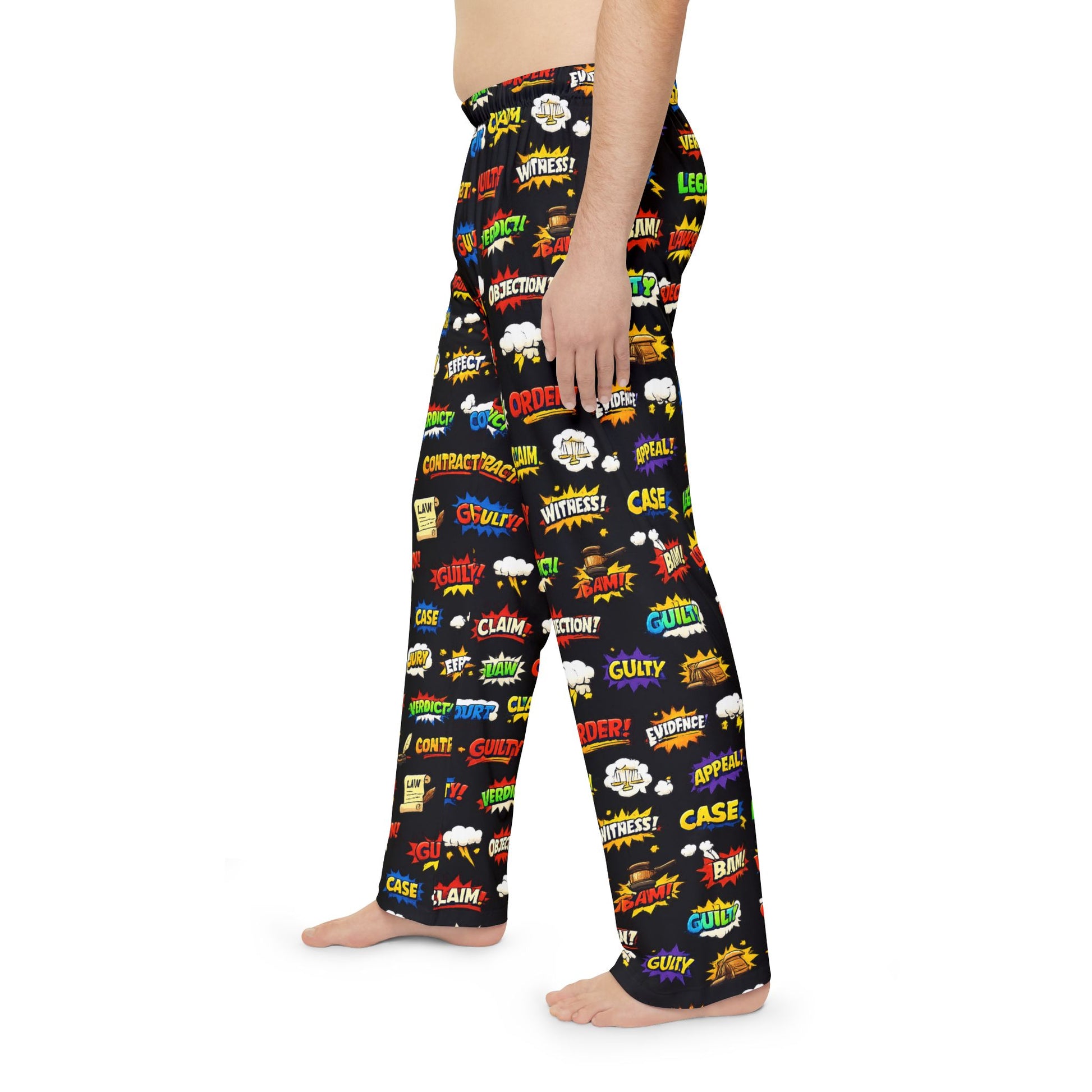 Person wearing black pajama pants with colorful text and graphics on a white background
