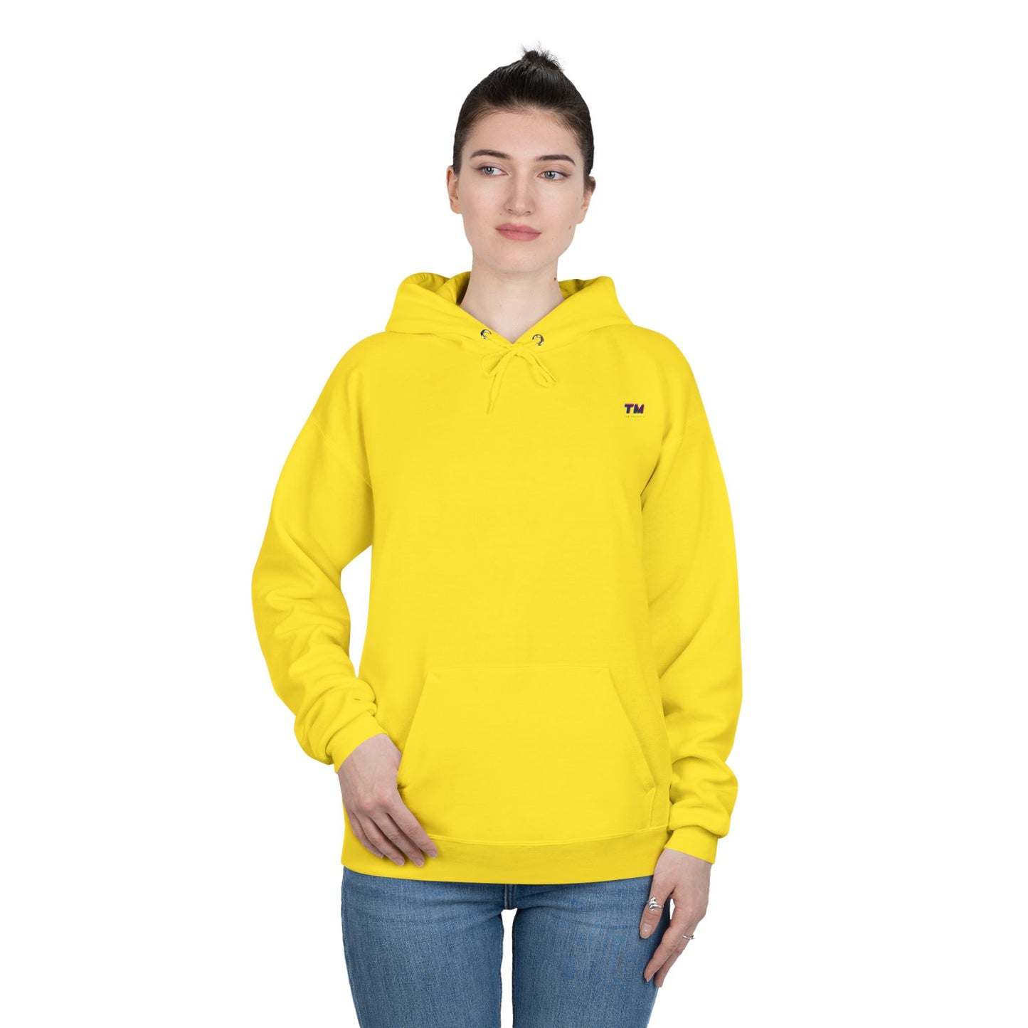 Woman wearing bright yellow EcoSmart hoodie with hands in pockets.