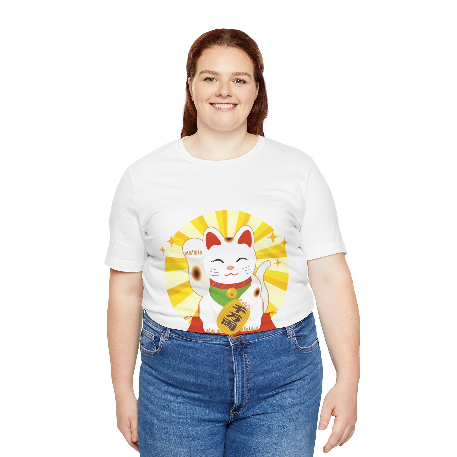Person wearing a white t-shirt with a colorful cat graphic on a white background