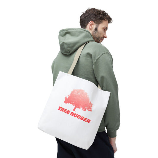 Man carrying Tree Hugger Tote Bag with red tree graphic