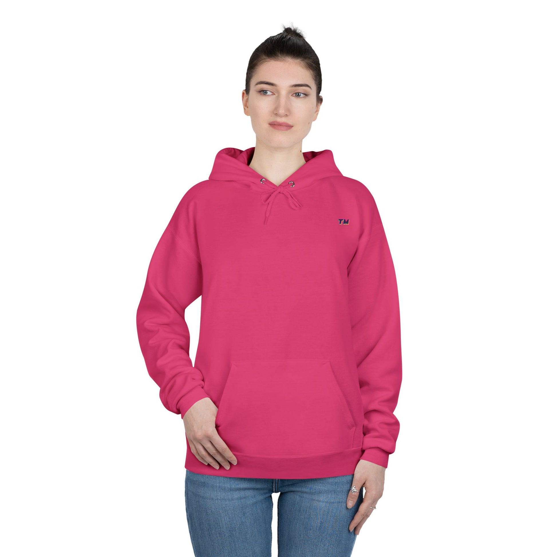 Woman wearing hot pink EcoSmart hoodie with relaxed fit.