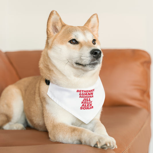 dog wearing OG NY housewives pet bandana collar lying on couch relaxed pose