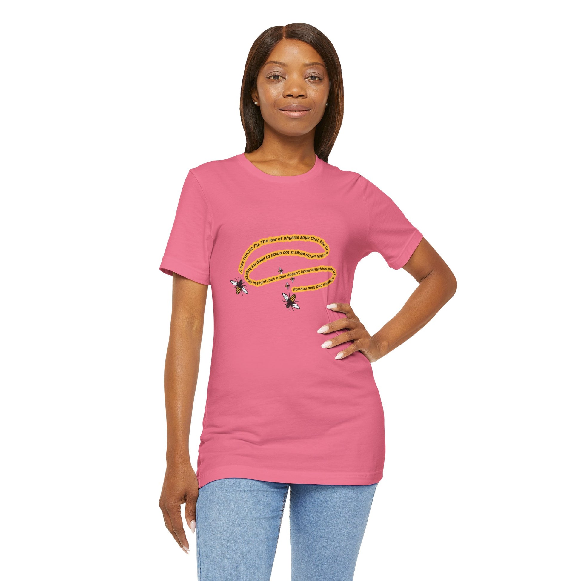 Woman in Charity Pink bee-themed quote shirt with hand on hip