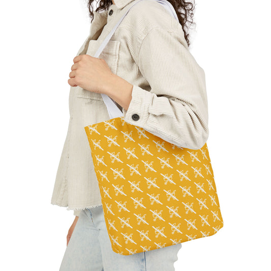 Proudly Childless yellow tote bag with white handles worn over shoulder by model in beige jacket