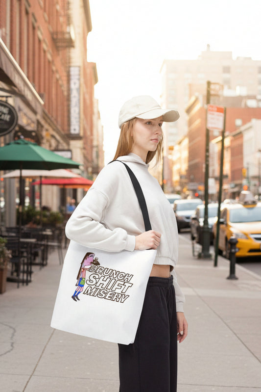 Model wearing Brunch Shift Misery tote bag on city street