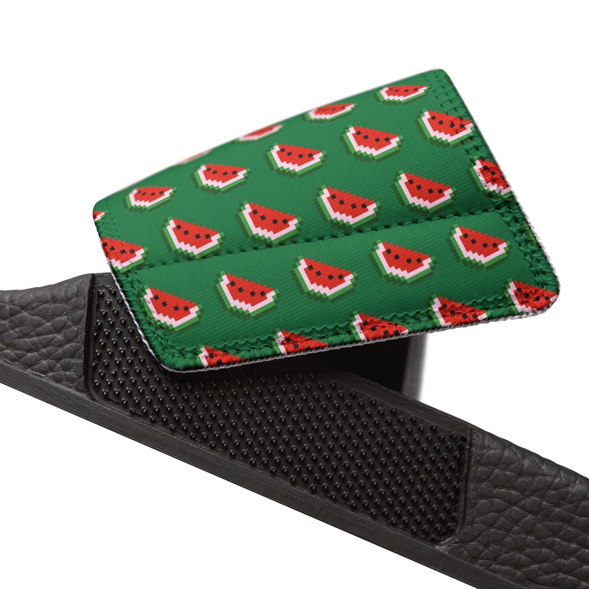 Close-up angled view of Watermelon Green Slide Sandal strap with repeating watermelon design.