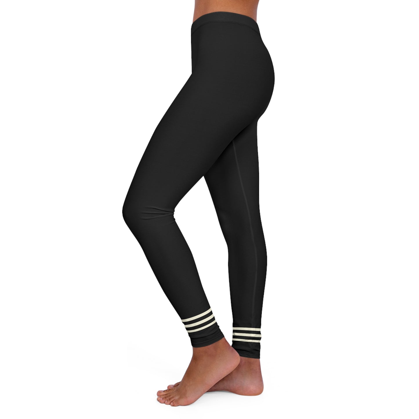 Side view of black leggings with striped ankle cuffs.