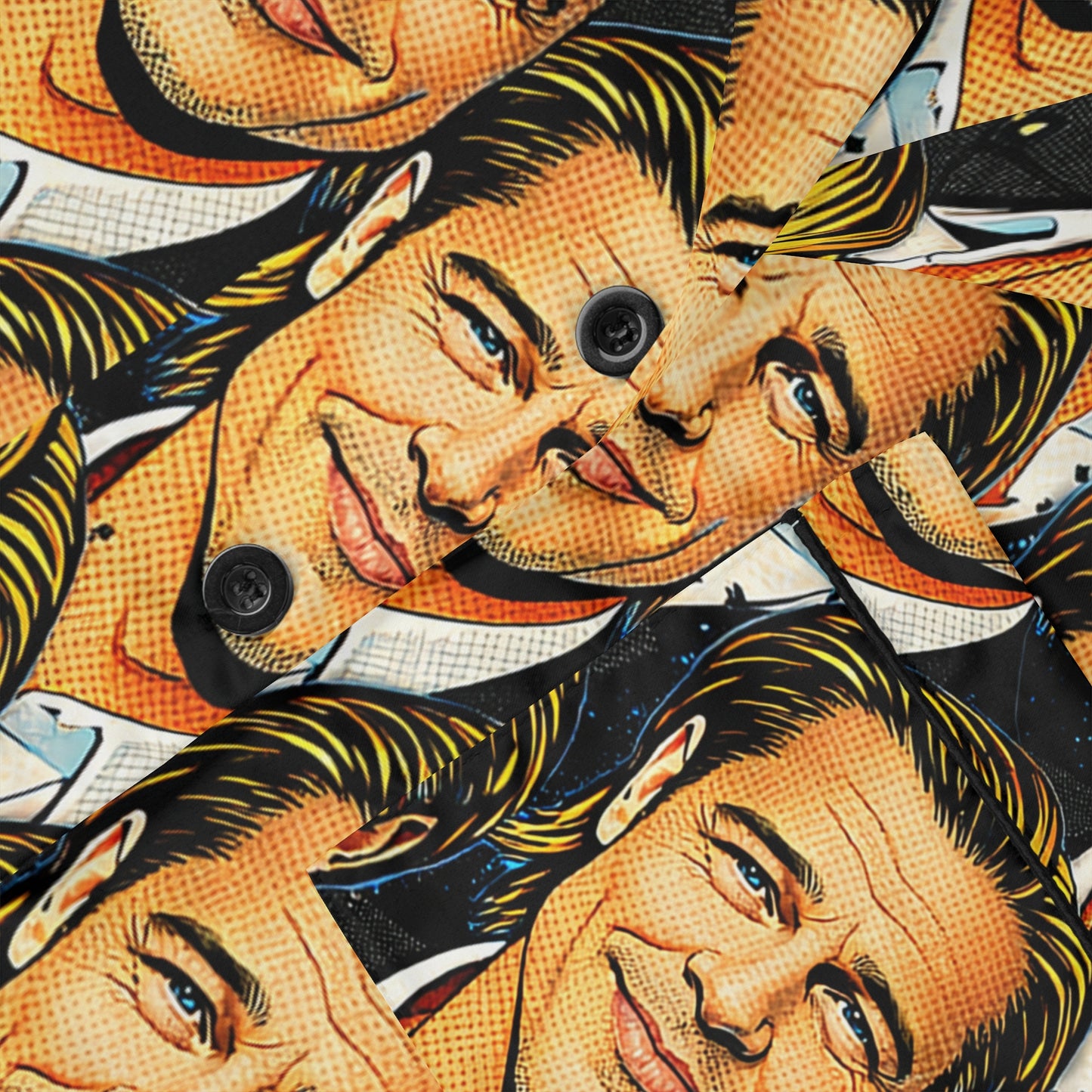 Close up of satin pajama fabric showing pop art face print, smooth texture, and button detail.