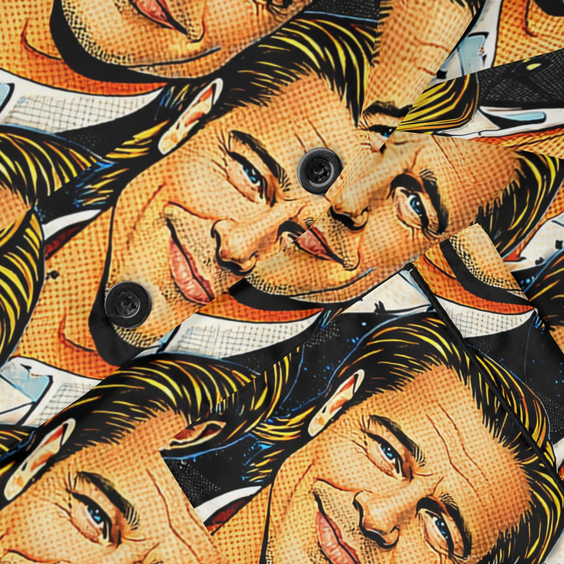 Close up of satin pajama fabric showing pop art face print, smooth texture, and button detail.