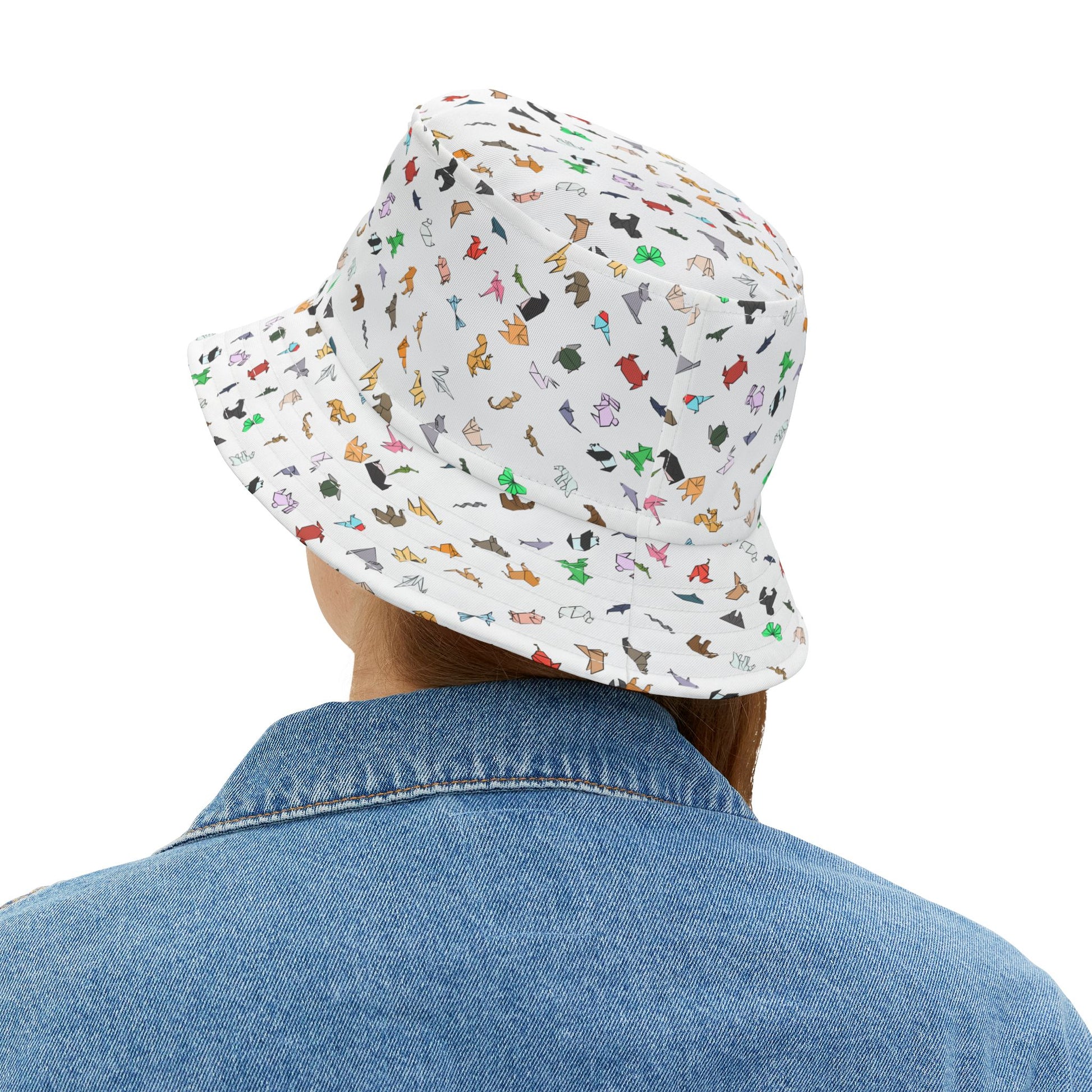 Rear angled view of patterned bucket hat with colorful origami animal figures