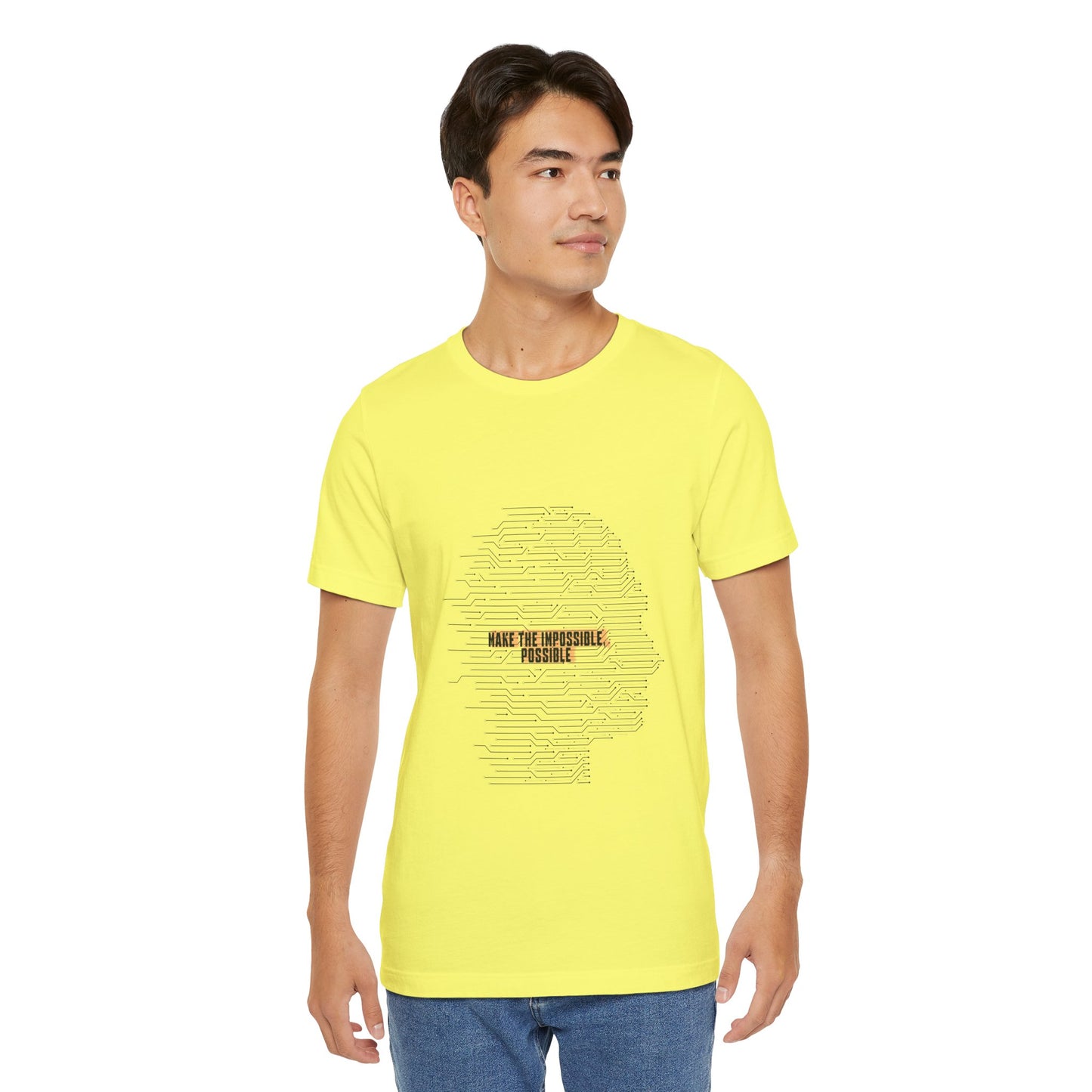 Man modeling yellow Make It Possible T-Shirt with bold futuristic text.