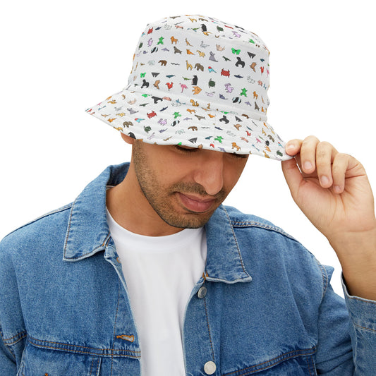 Man wearing patterned bucket hat with colorful origami animal figures, looking down while holding brim
