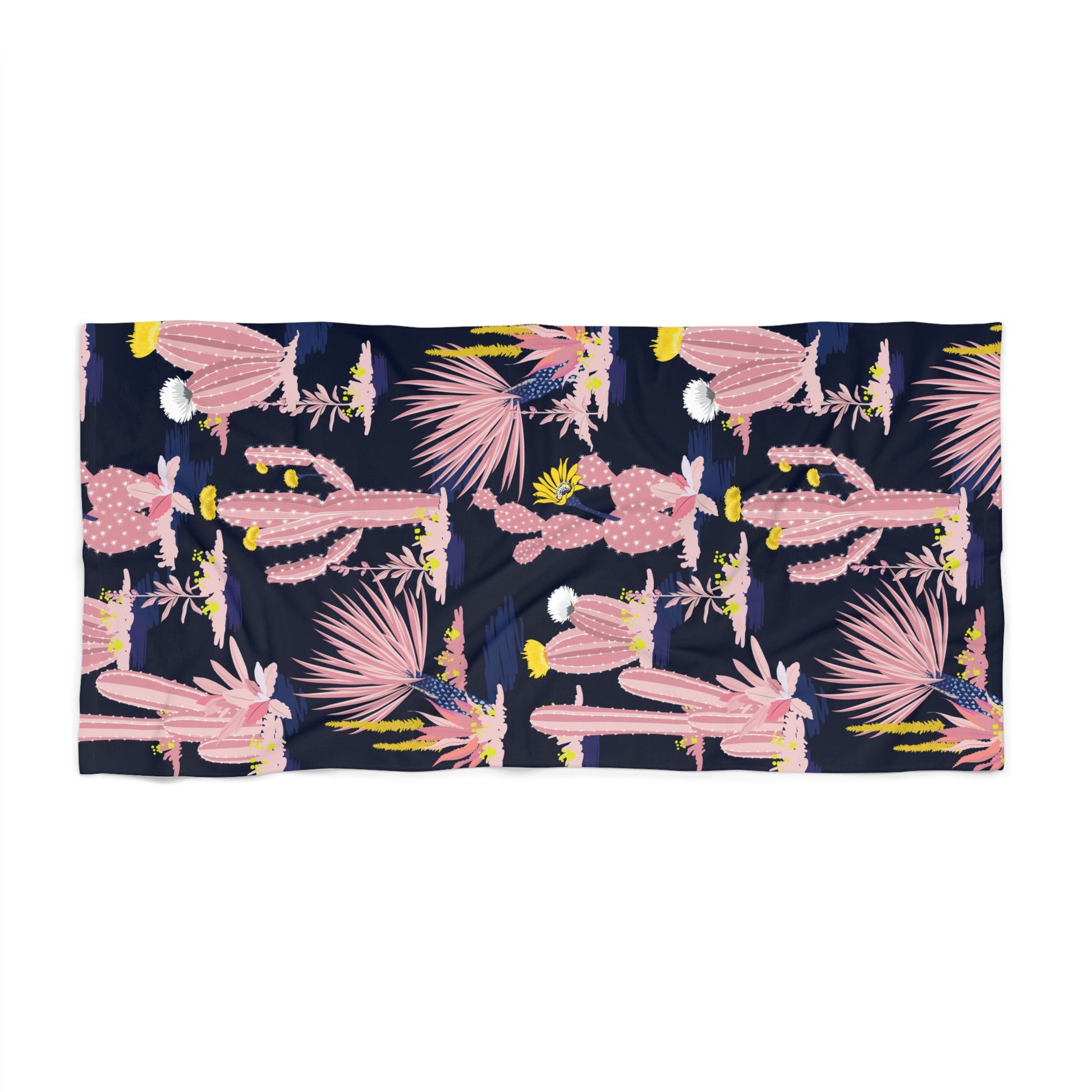 Flat lay of pink cactus patterned beach towel on white background