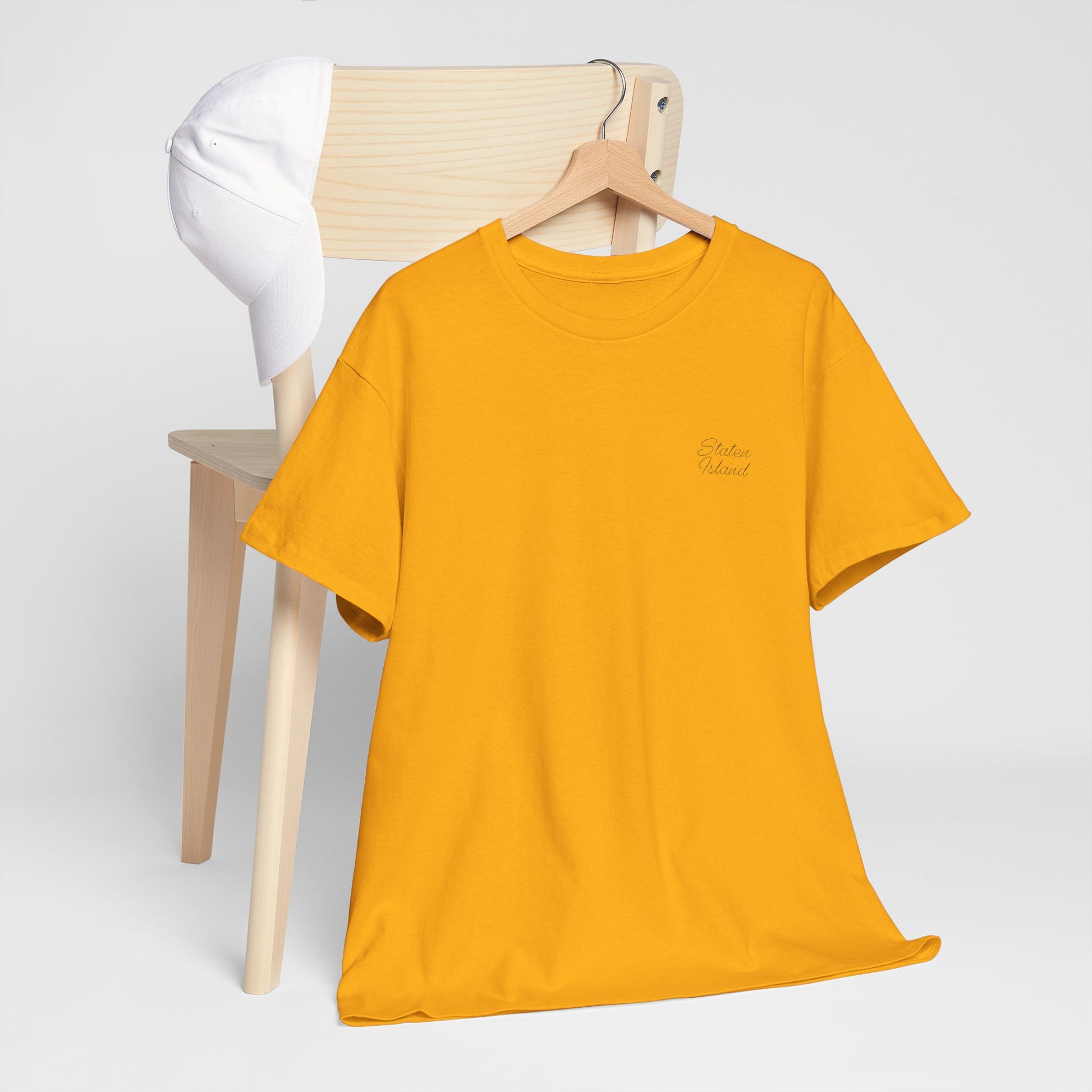 Gold Staten Island T-Shirt on hanger with front design.