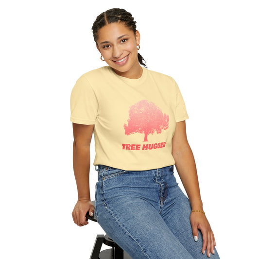 Smiling woman wearing yellow Tree Hugger T-shirt with red tree graphic