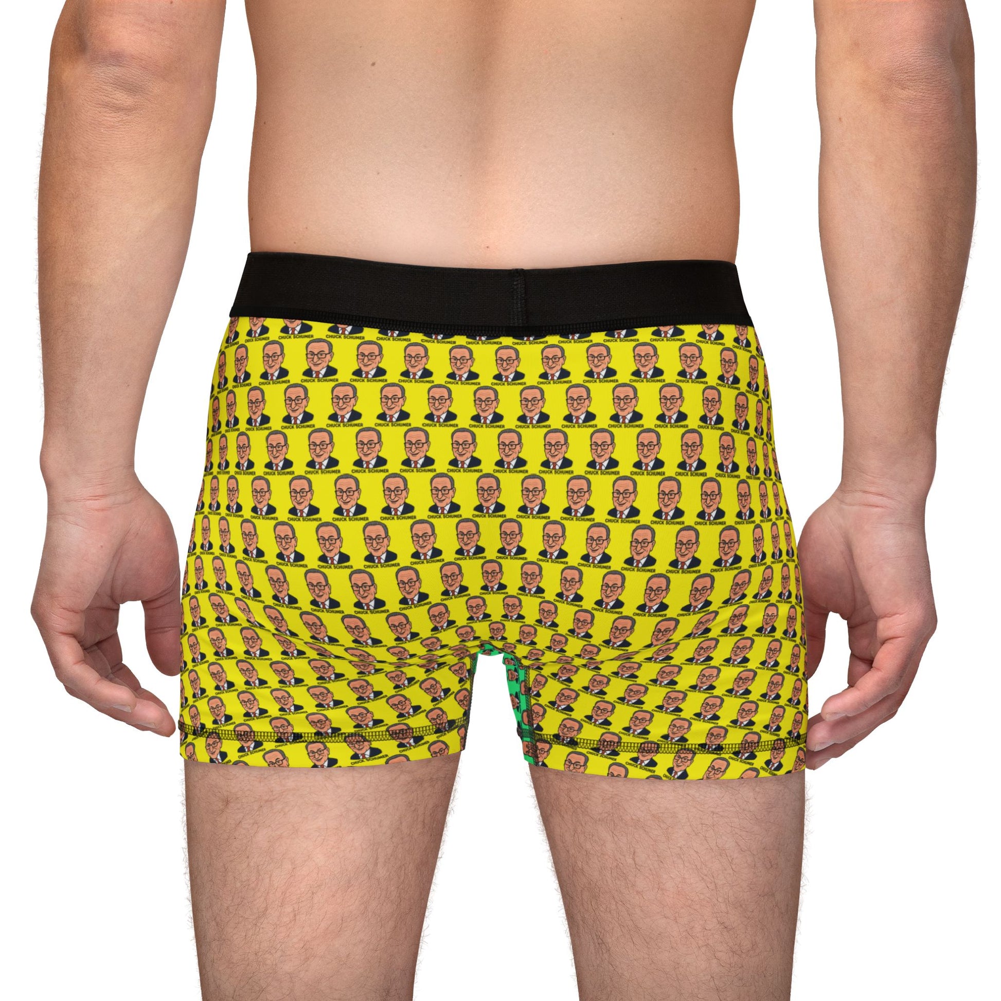 Back view of model wearing Chuck Schumer boxer briefs with all-over yellow face pattern and black waistband
