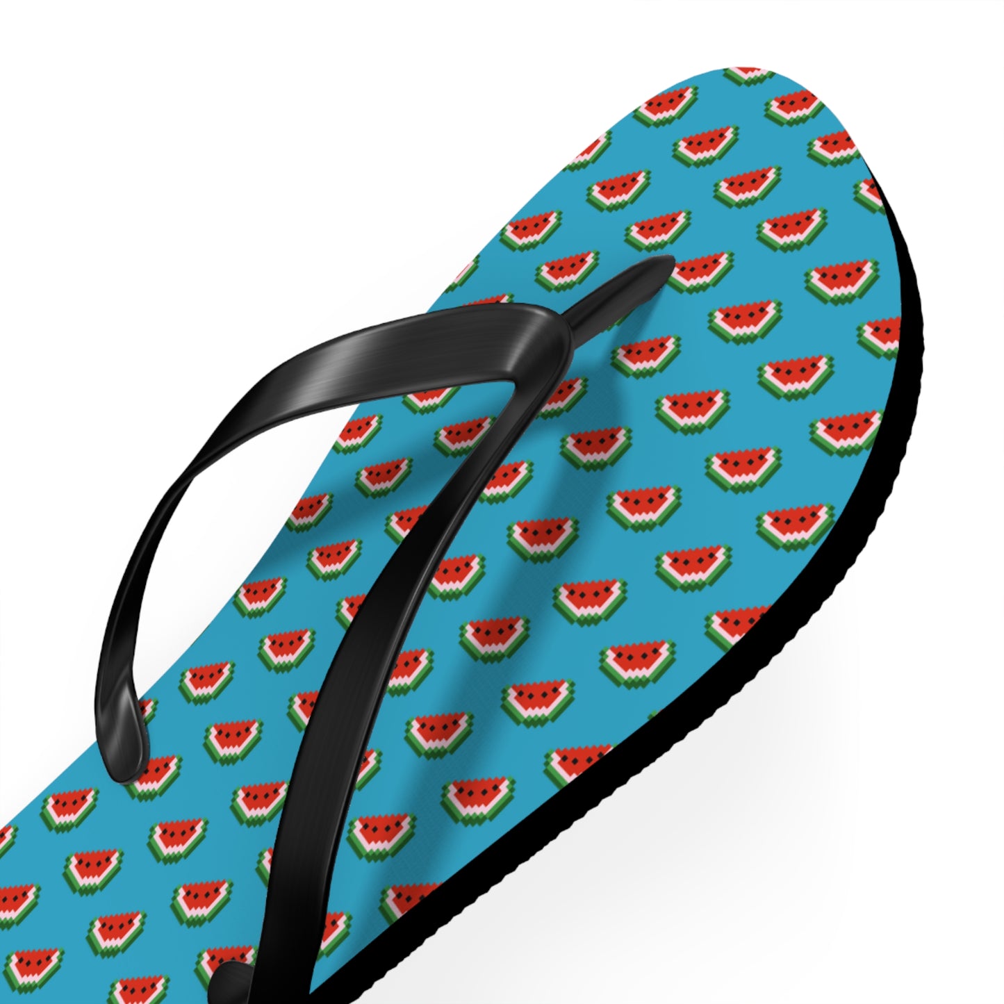 Close-up of watermelon pattern on turquoise flip flop strap