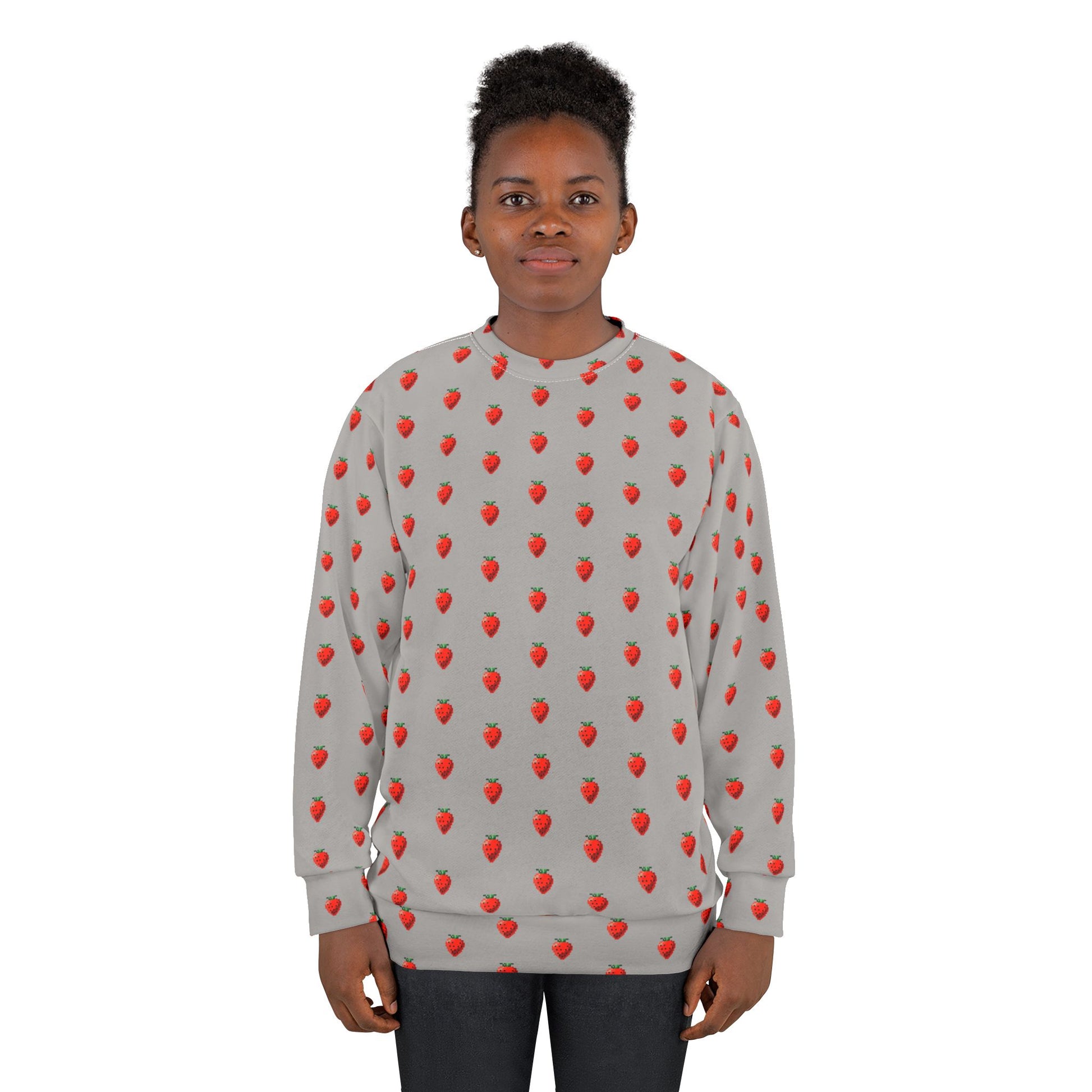 Young model wearing 8-bit Strawberry Sweatshirt with pixel strawberry print