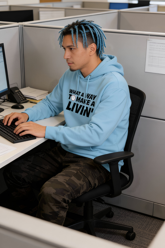 Model sitting in office cubicle wearing light blue 9 to 5 hoodie