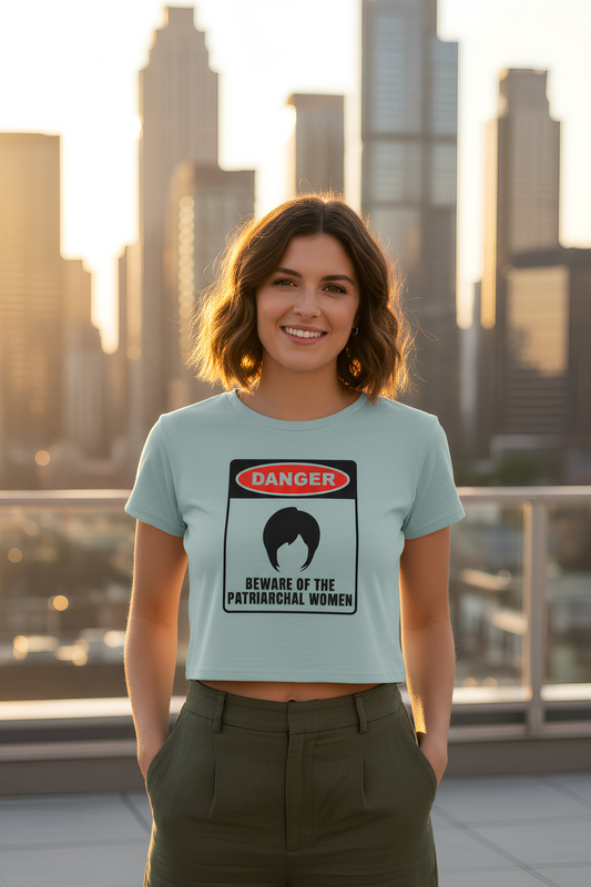 Woman wearing black crop top with “Beware of the Patriarchal Women” text, casual streetwear outfit