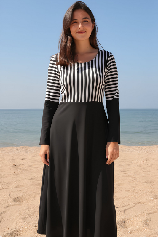 Black and White Long Sleeve Midi Dress woman wearing dress on beach front view