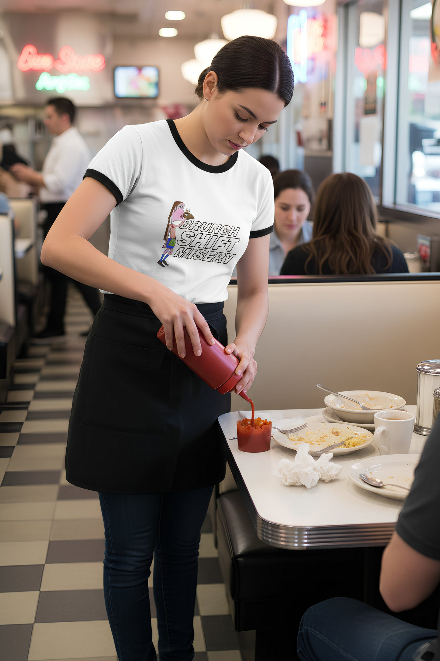 waitress wearing brunch shift misery ringer t-shirt serving food in diner