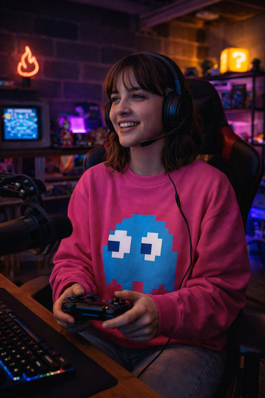 Model wearing blue pixel ghost sweatshirt in gaming room