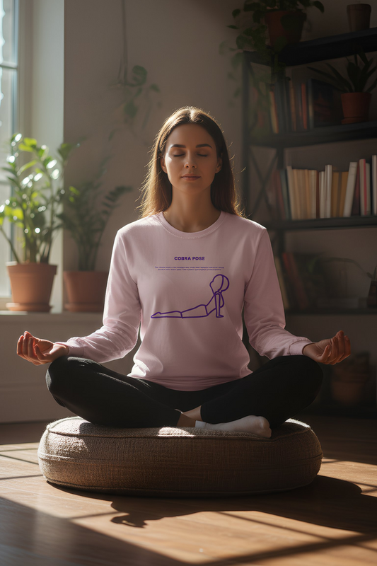 Woman meditating indoors wearing pink Cobra Pose long sleeve shirt