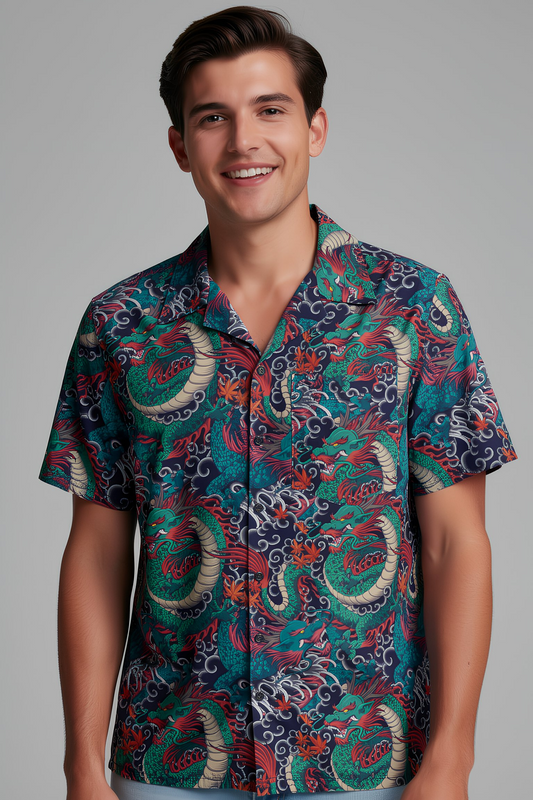 Man wearing dragon tattoo patterned short sleeve button up shirt with teal and red design, front studio portrait