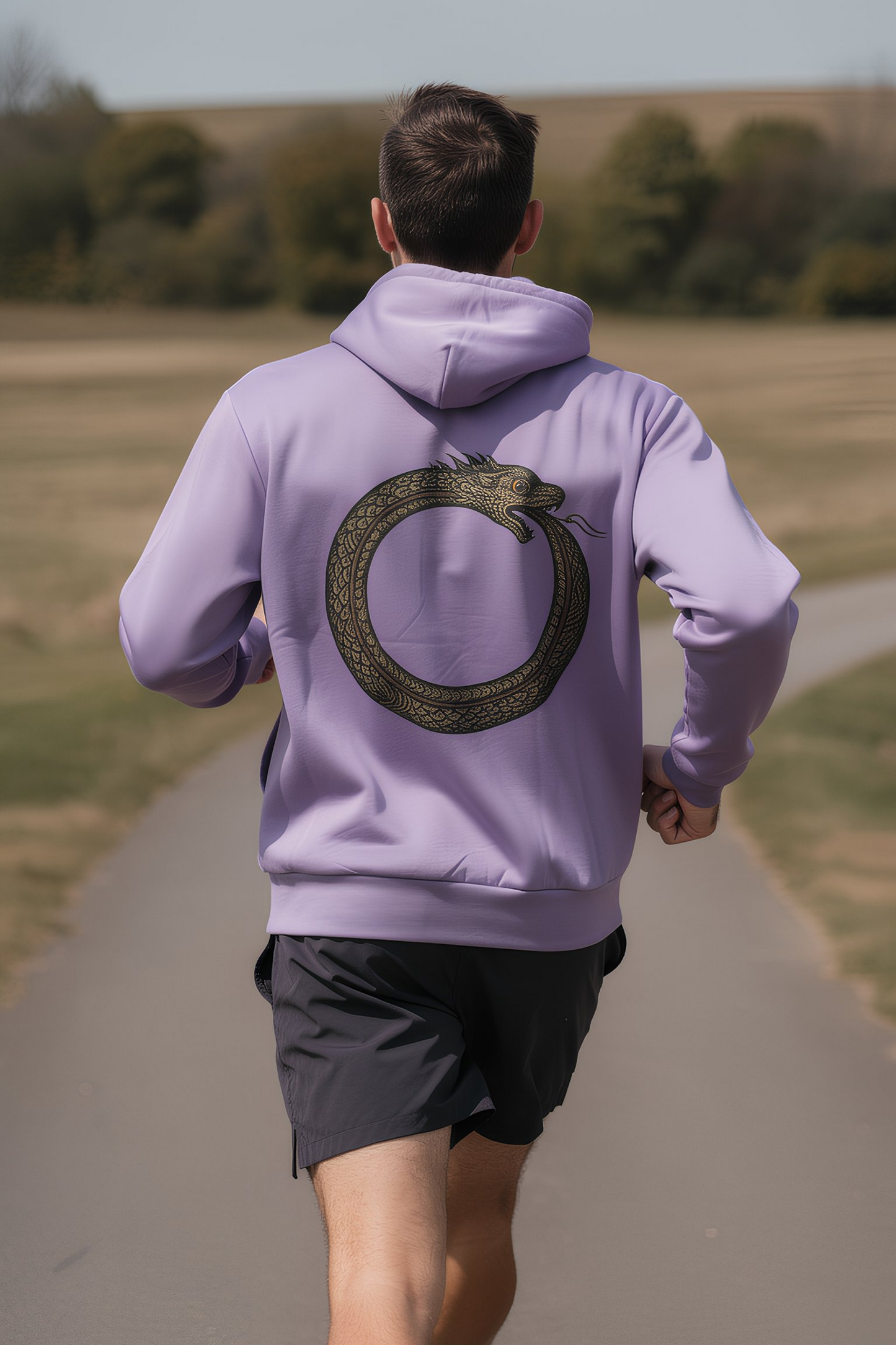 Person wearing white Good Karma hoodie walking toward mountains
