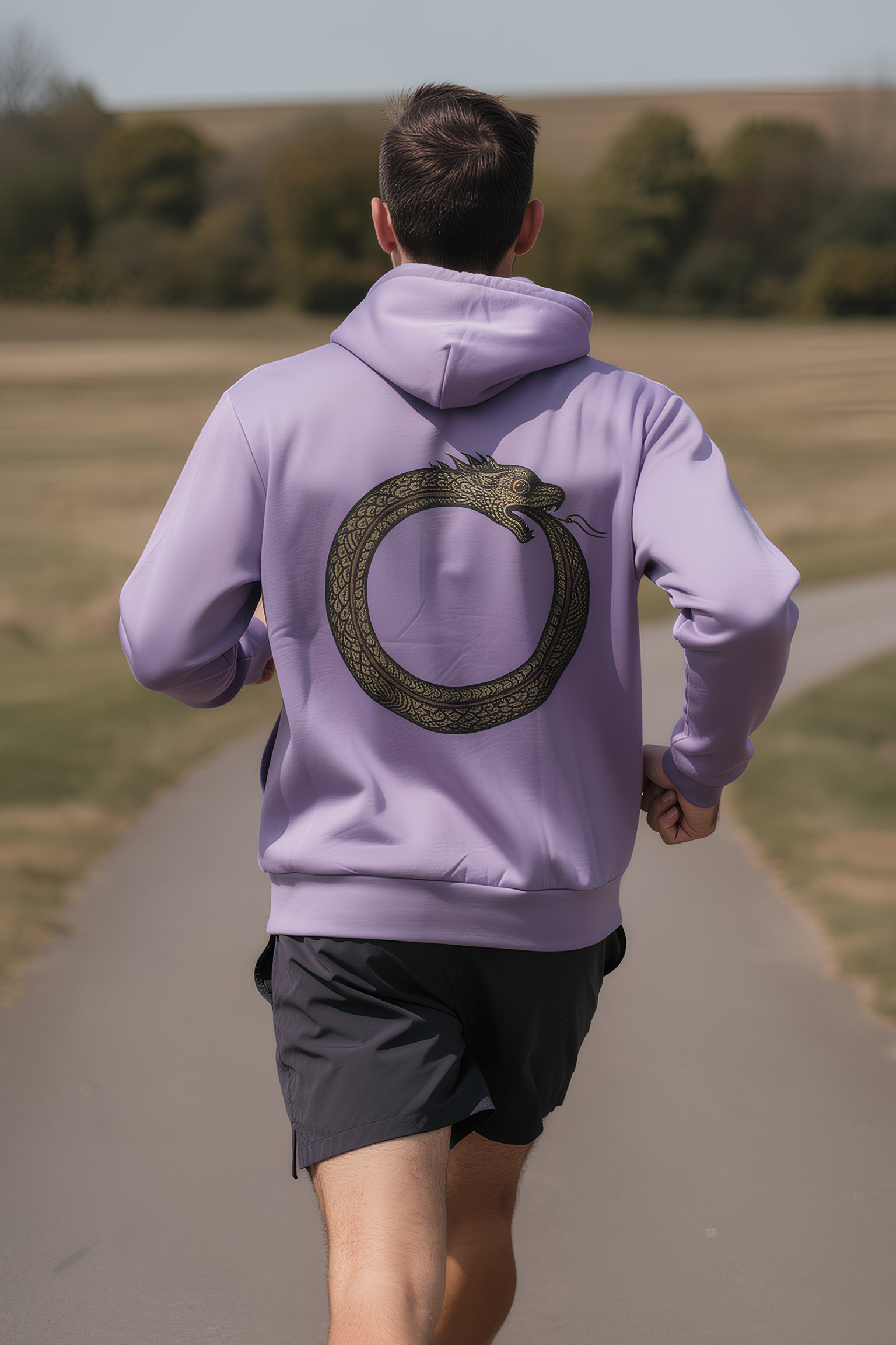 Person wearing white Good Karma hoodie walking toward mountains