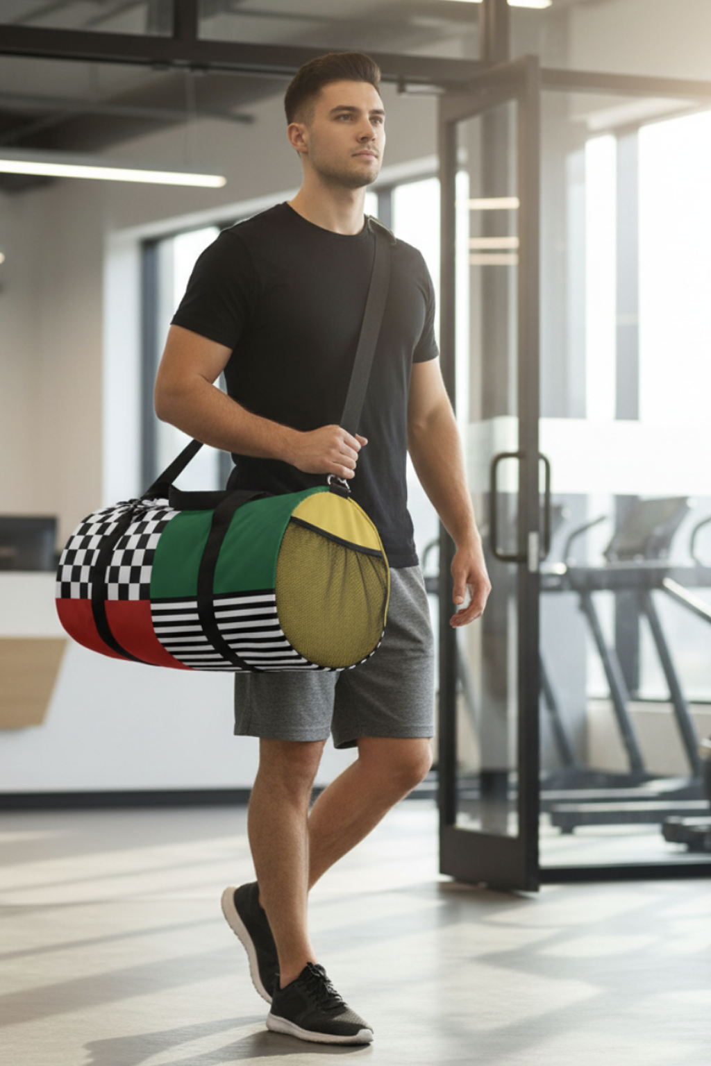 Man holding a Gridlock duffel bag in an indoor setting