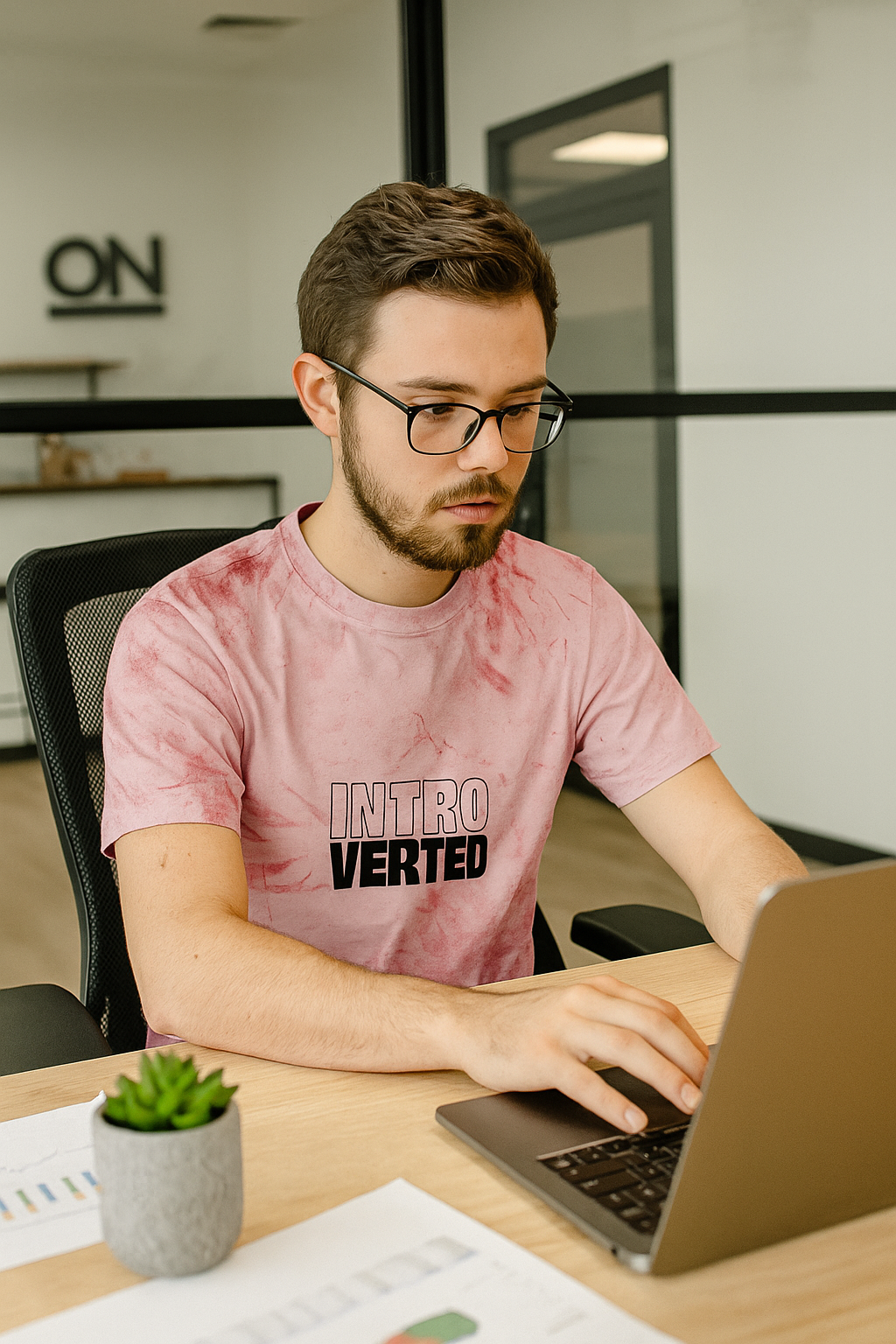 introverted color blast t-shirt pink tie dye unisex graphic tee male model working laptop