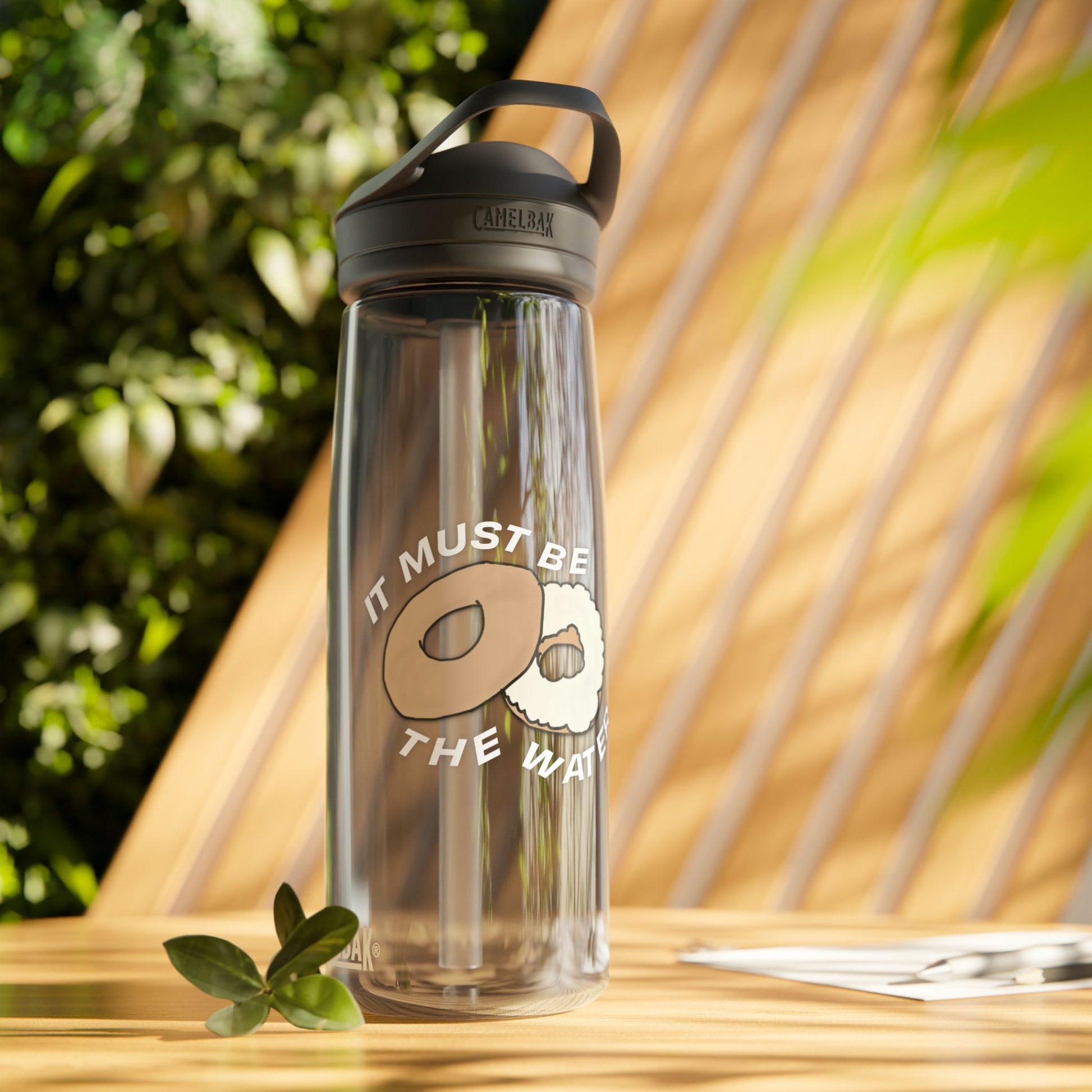 It Must Be The Water reusable bottle 25oz with donut humor artwork on blue water bottle