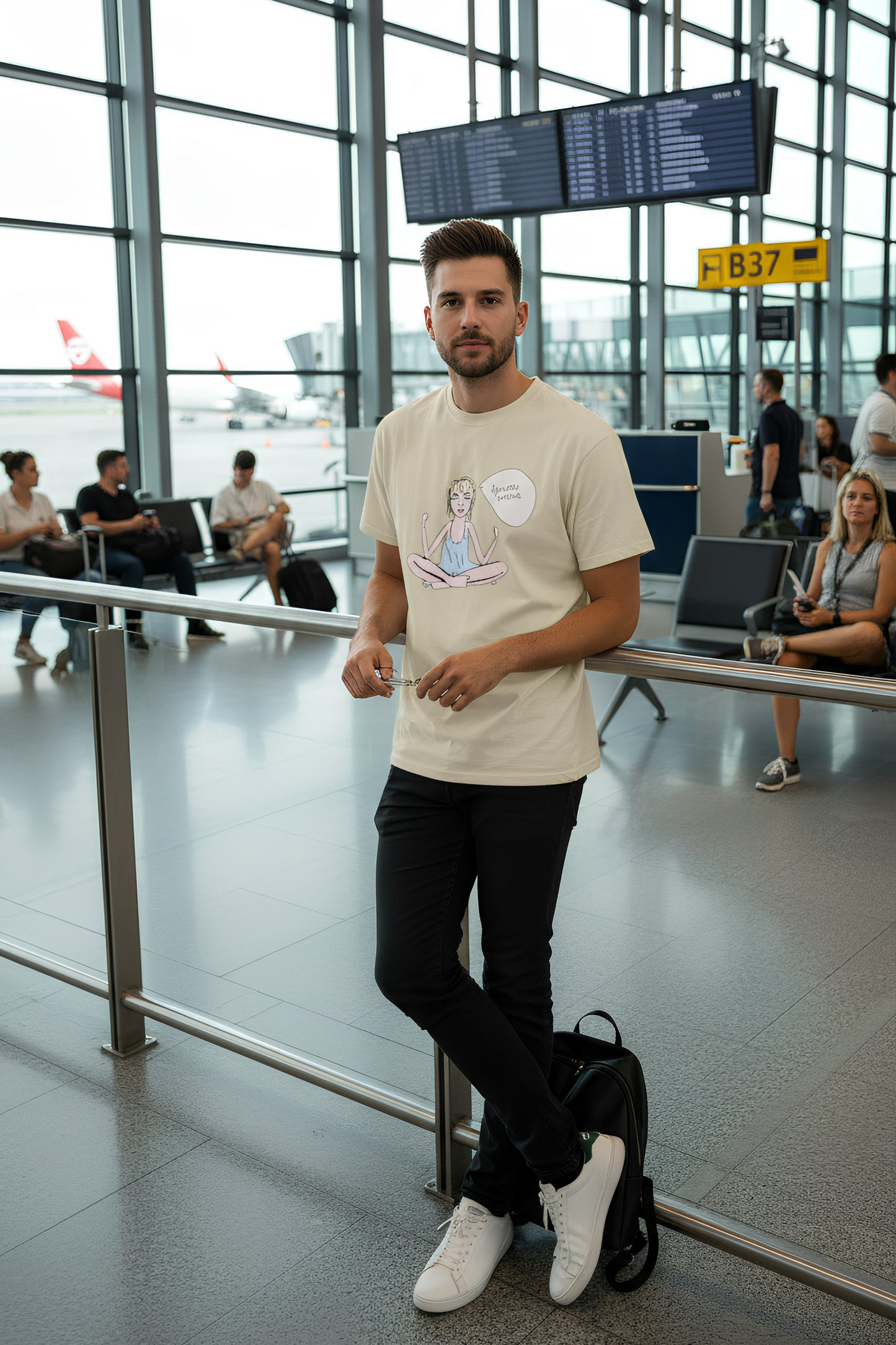 Man wearing beige Log Out T-shirt in terminal