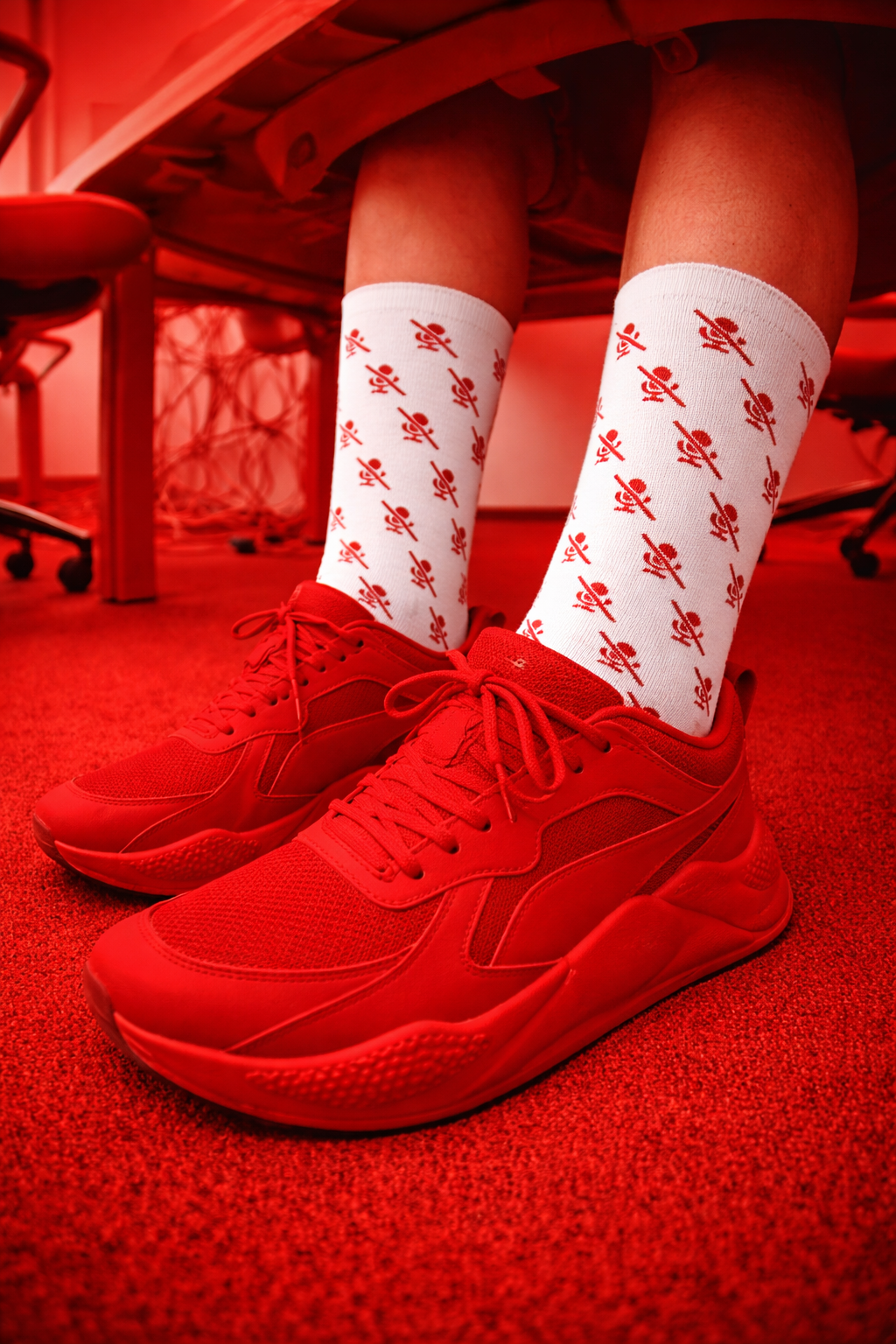 mic off socks white with red pattern lifestyle shot red lighting sneakers outfit