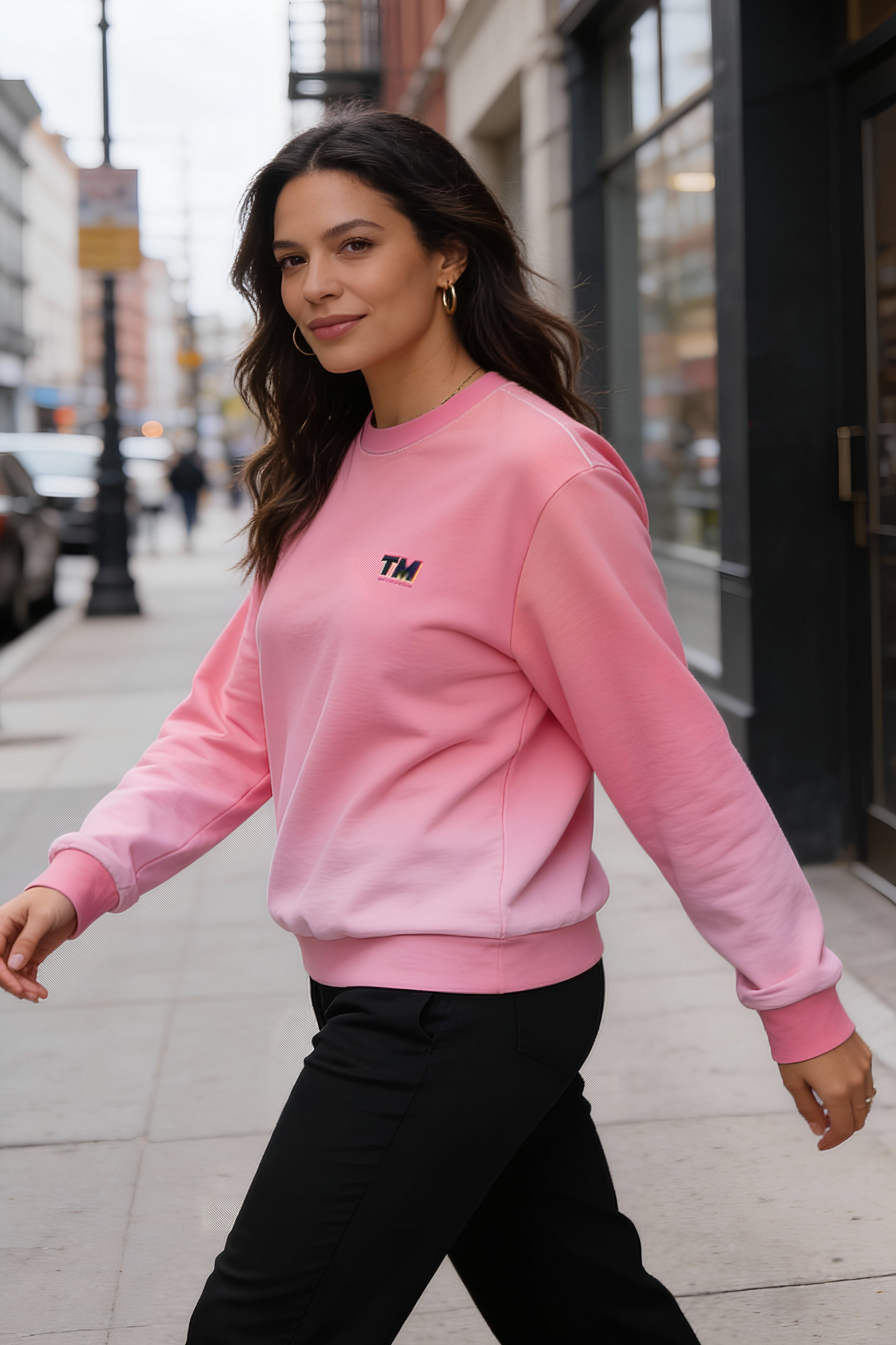 Pink Gradient Unisex Sweatshirt worn by woman walking on city street
