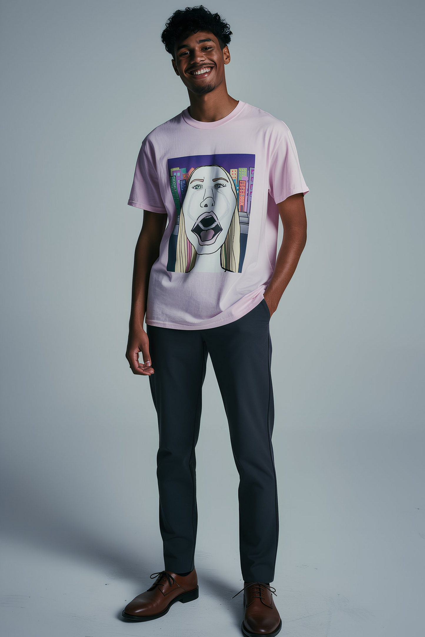 Man wearing light pink graphic T shirt with pop art screaming face illustration, studio outfit