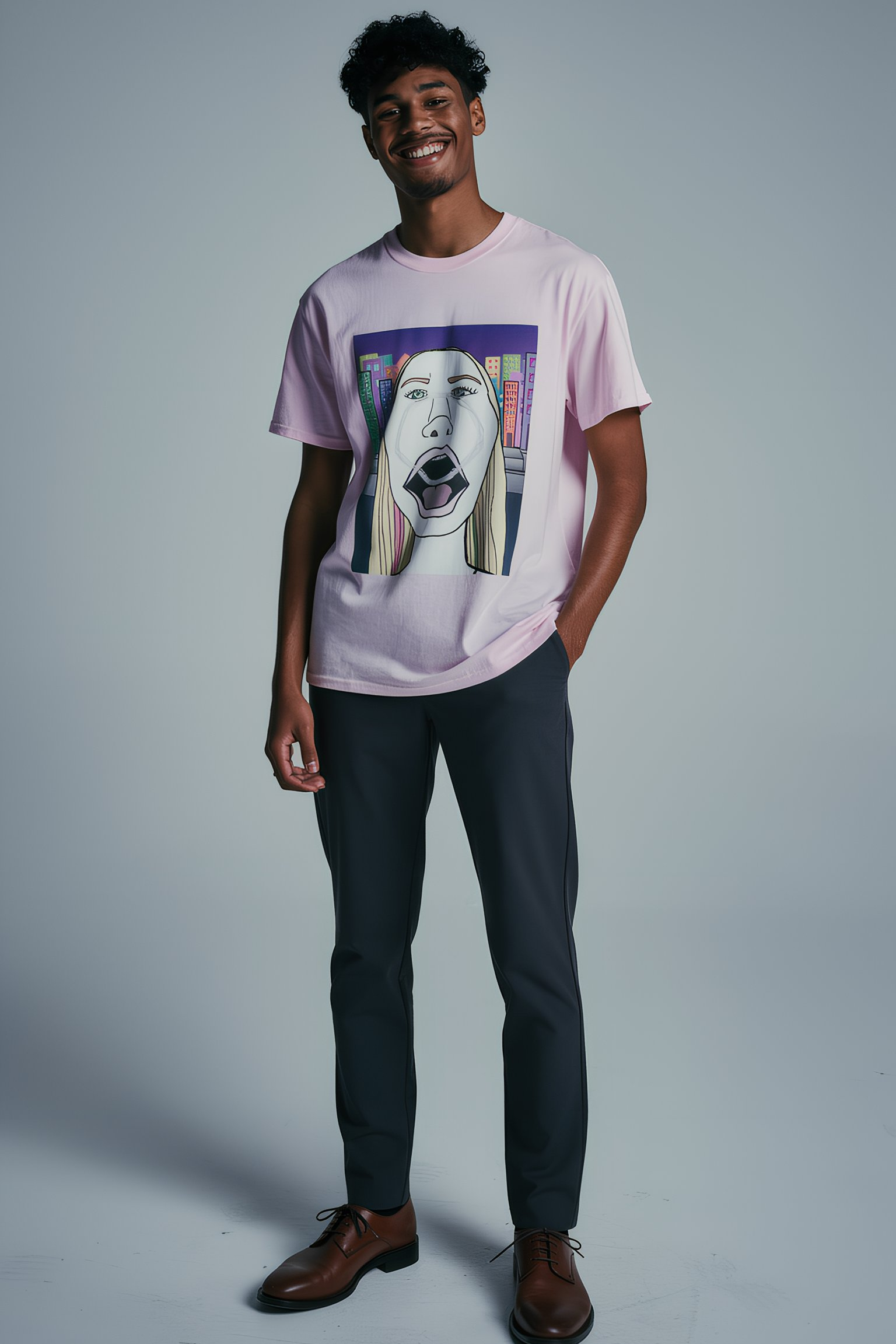 Man wearing light pink graphic T shirt with pop art screaming face illustration, studio outfit