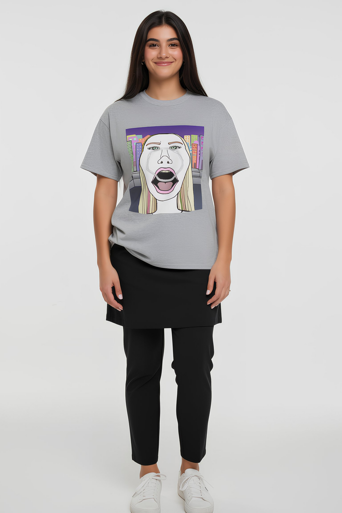 Model wearing gray graphic T shirt with pop art face design, full body lifestyle view