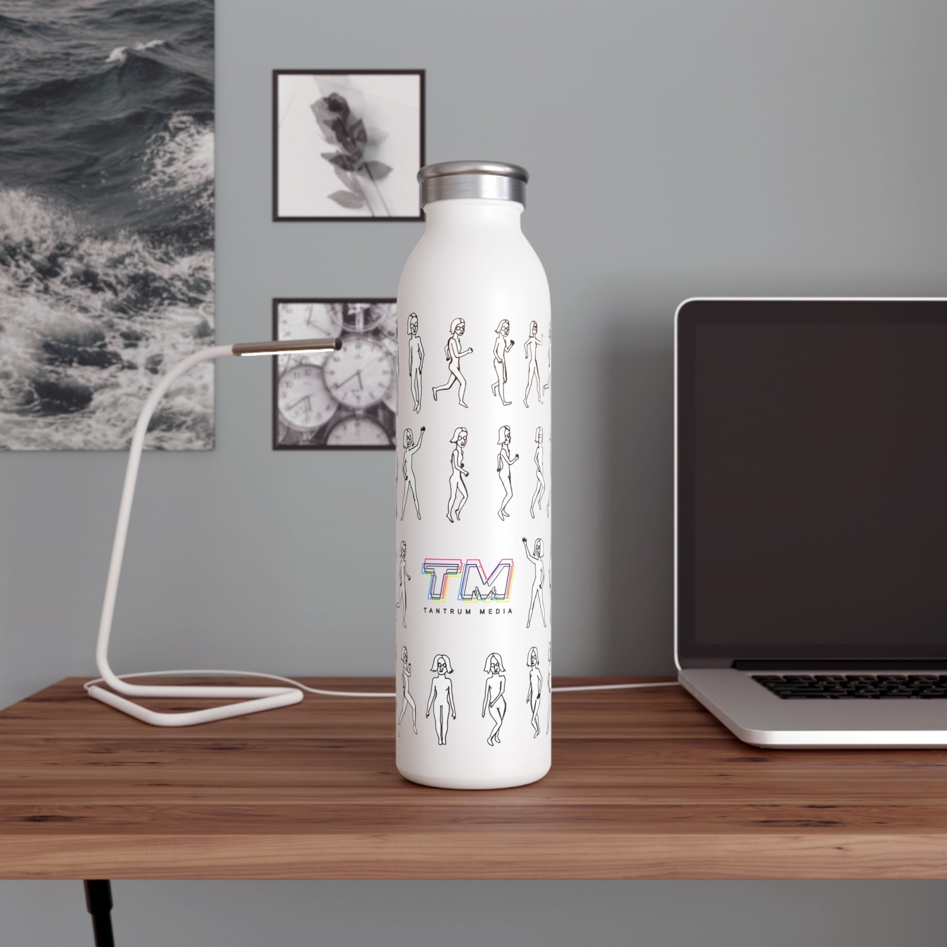 unning Out Water Bottle with artsy logo design on a desk beside a laptop and notebook