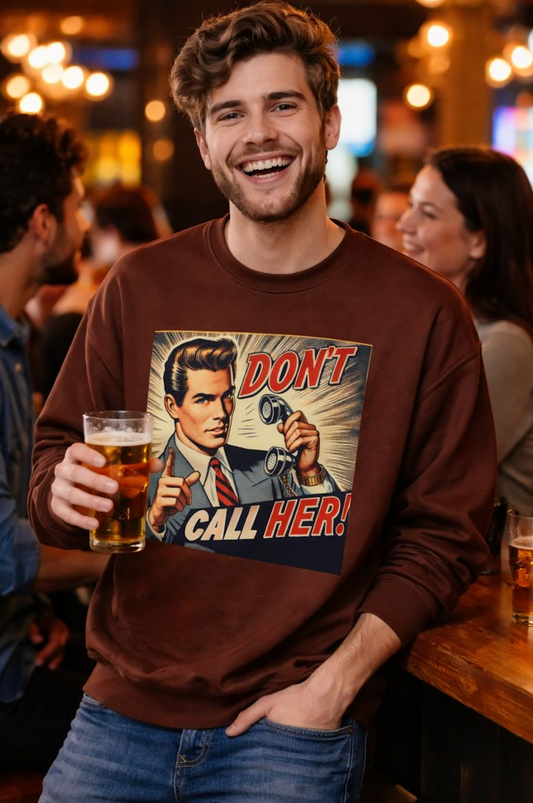 Dont Call Her Retro Pop Art Unisex Sweatshirt worn by a man in a bar holding a drink, showing the vintage pop art graphic