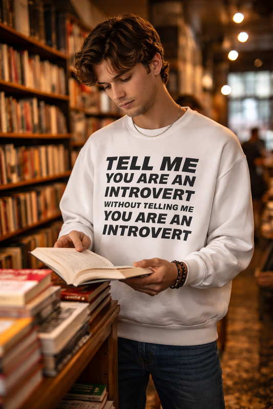 tell me youre an introvert sweatshirt white crewneck male model reading bookstore