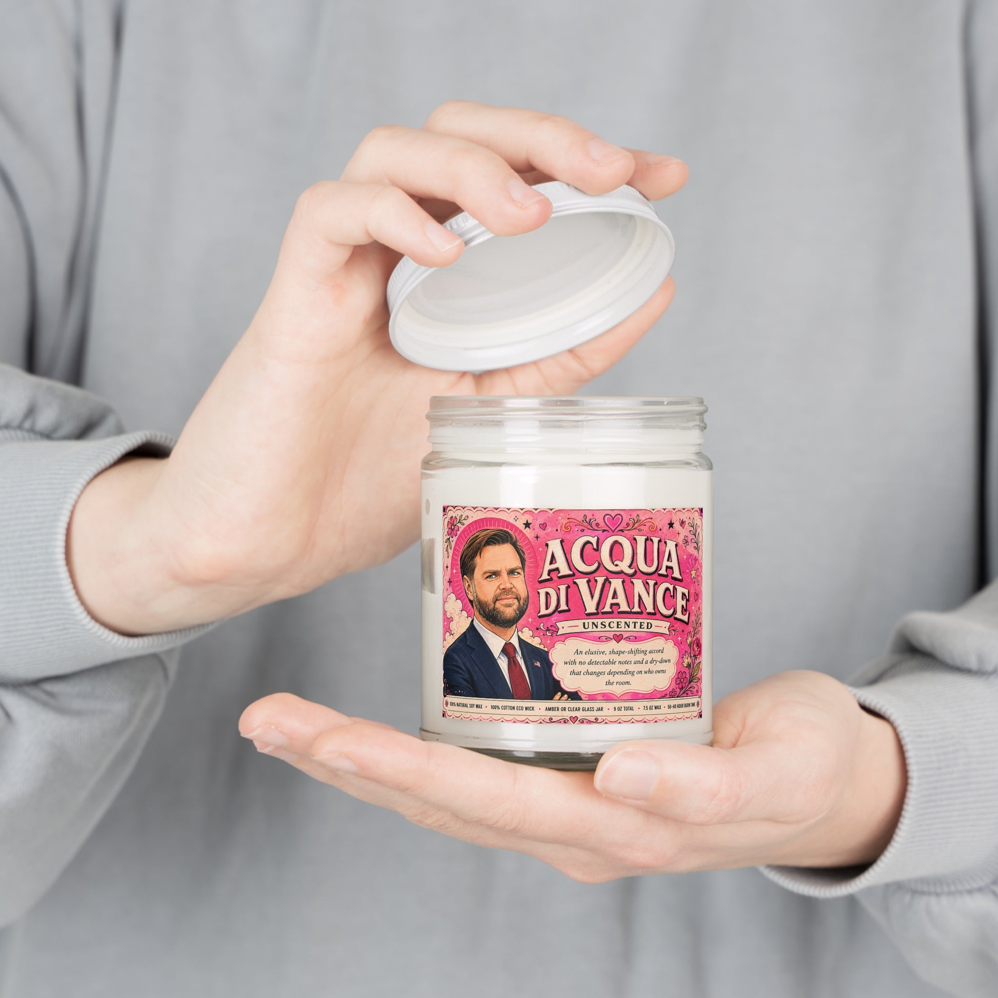Person holding the Acqua di Vance unscented JD Vance satire candle