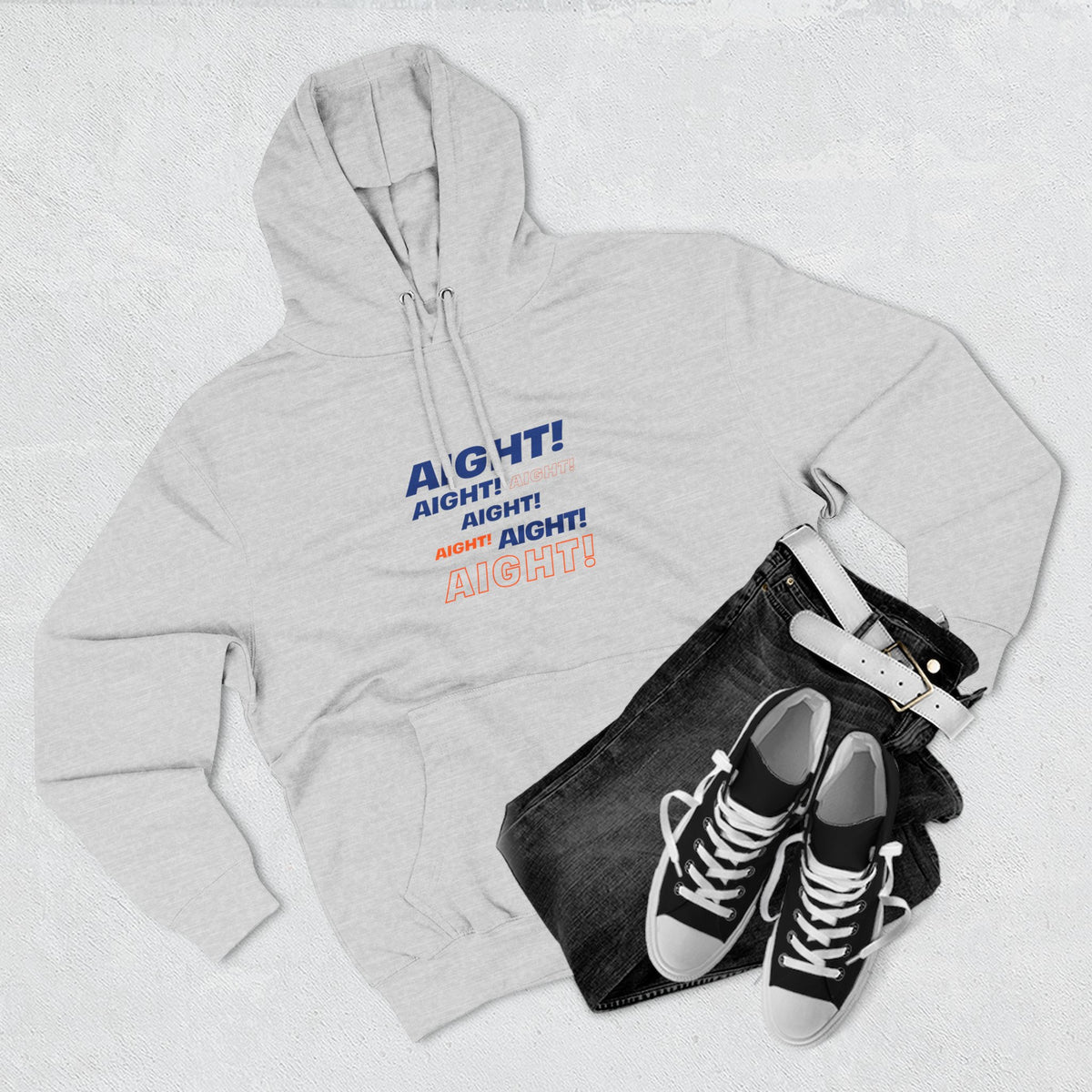 Gray Aight unisex graphic hoodie styled in a flat lay with sneakers and accessories