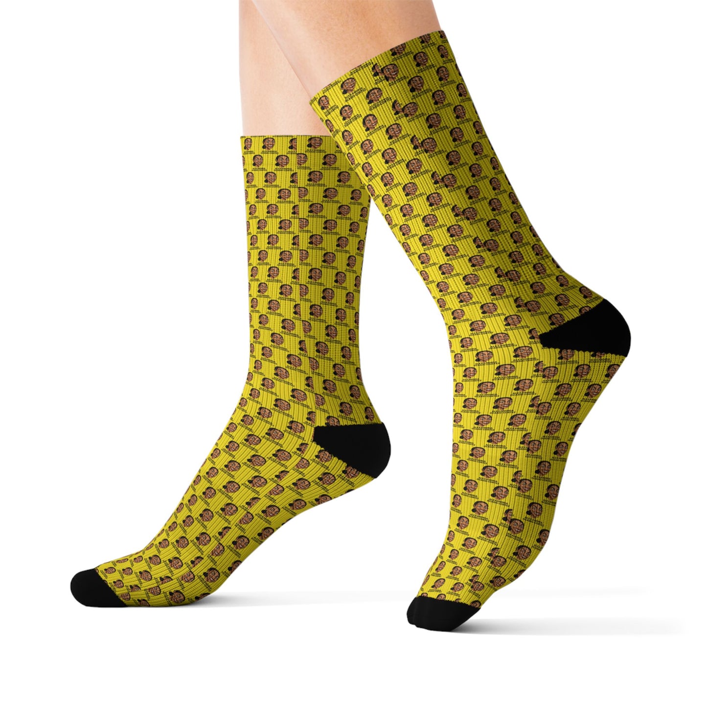 Model wearing yellow AOC crew socks with repeating Alexandria Ocasio-Cortez artwork pattern, shown in a side profile view.