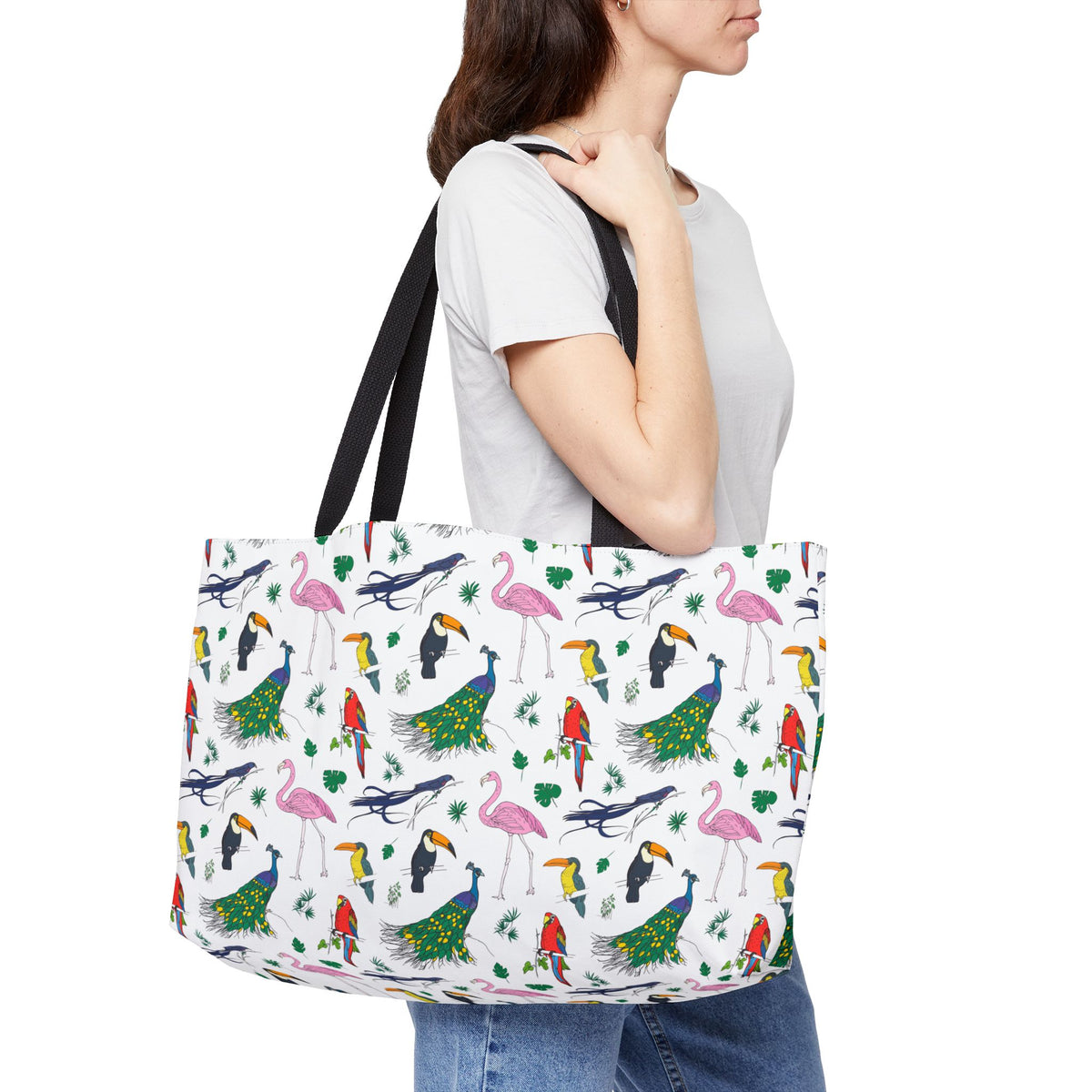 Woman carrying Avian bird print weekender bag in a casual travel outfit