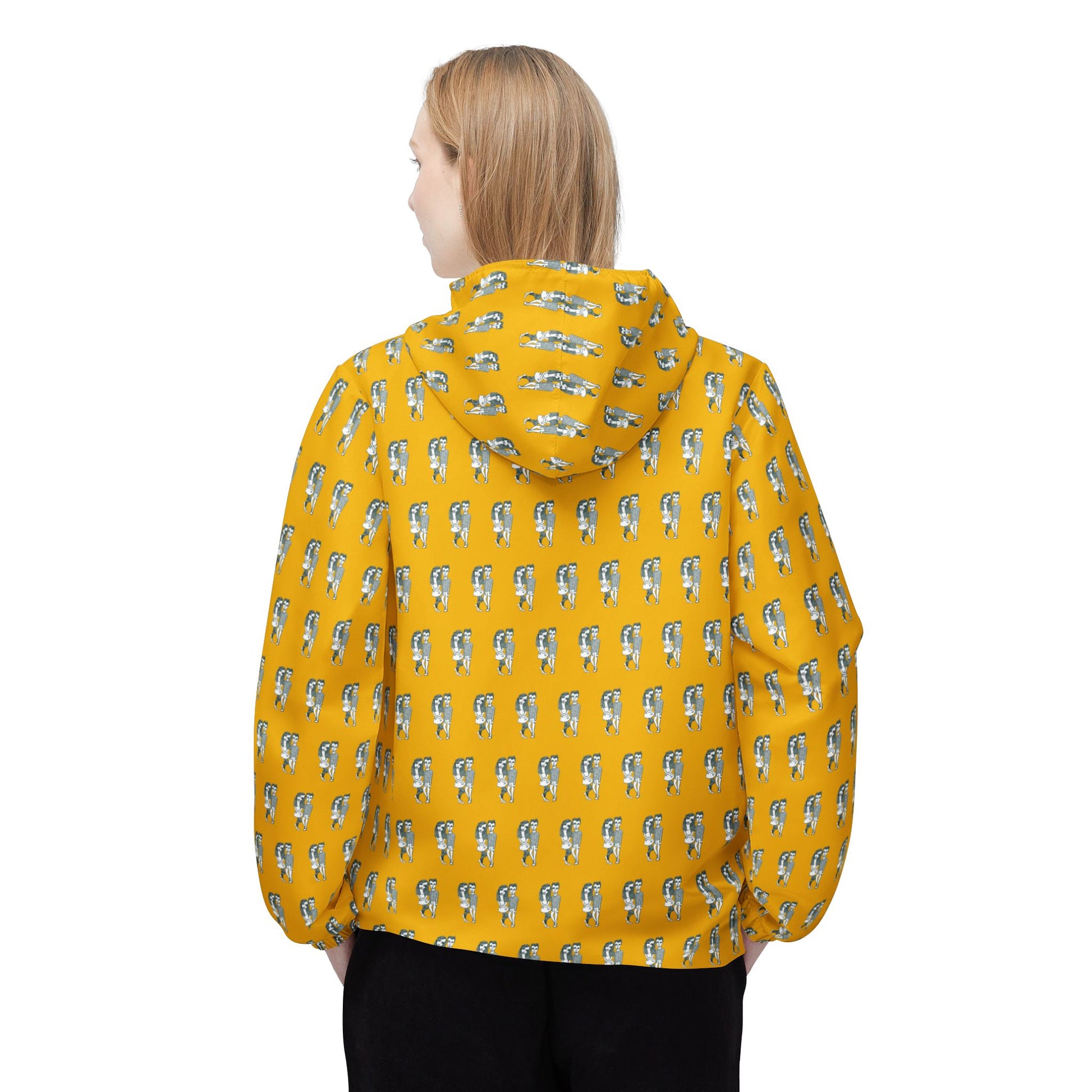 Back view of woman wearing Babes yellow windbreaker jacket with all-over illustrated pattern