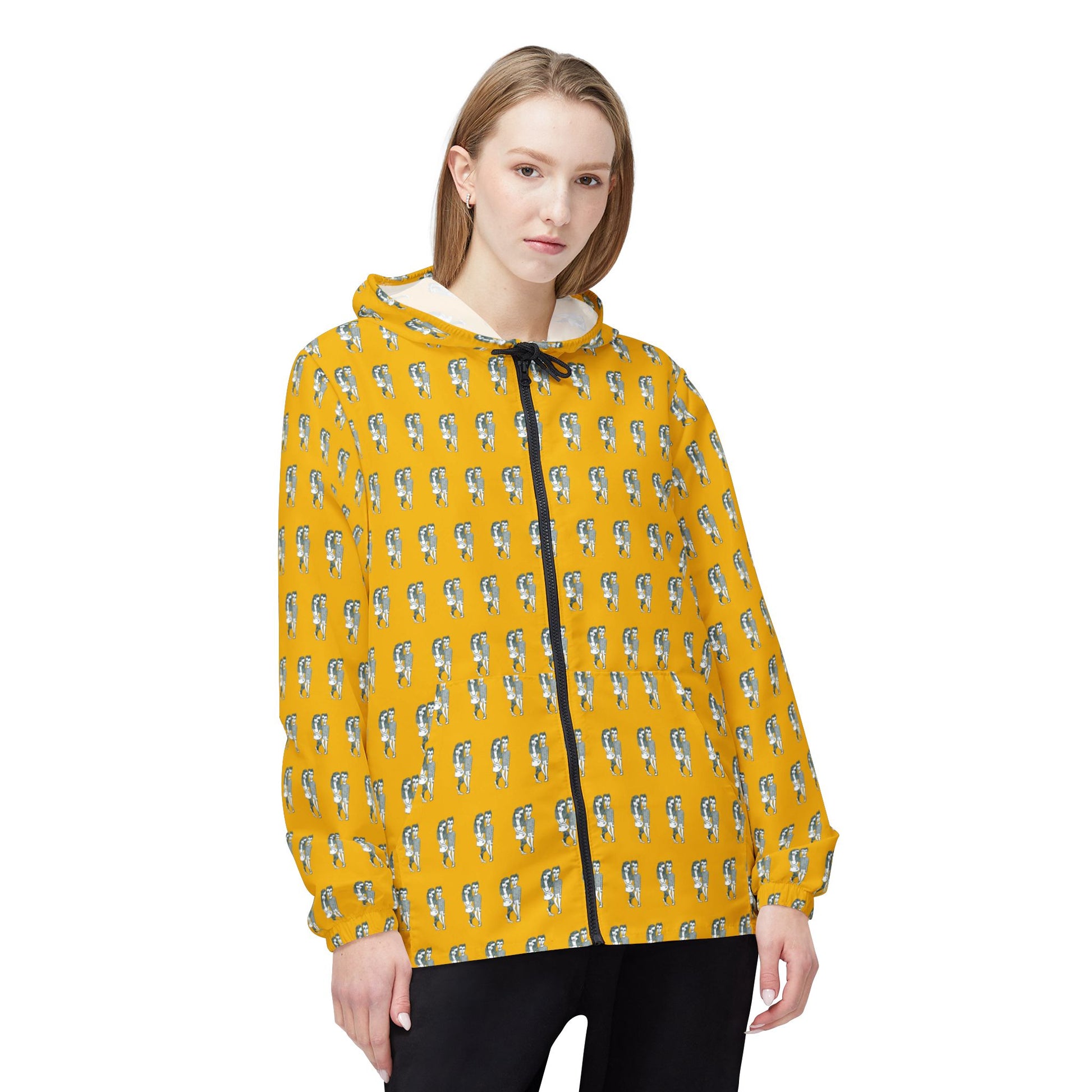 Front view of woman wearing yellow Babes windbreaker jacket with retro couple print