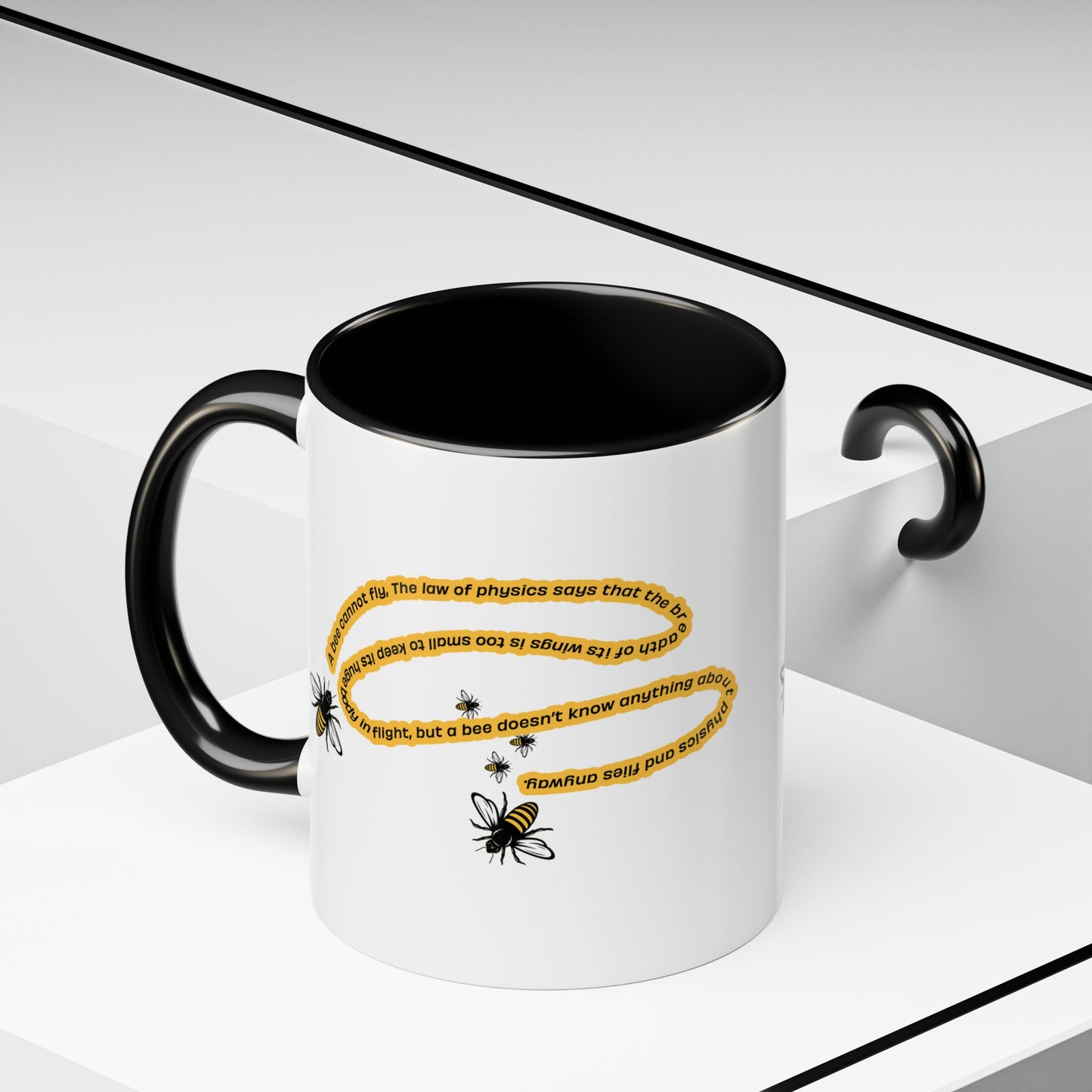 Black accent bee physics quote mug in a clean modern minimalist setting